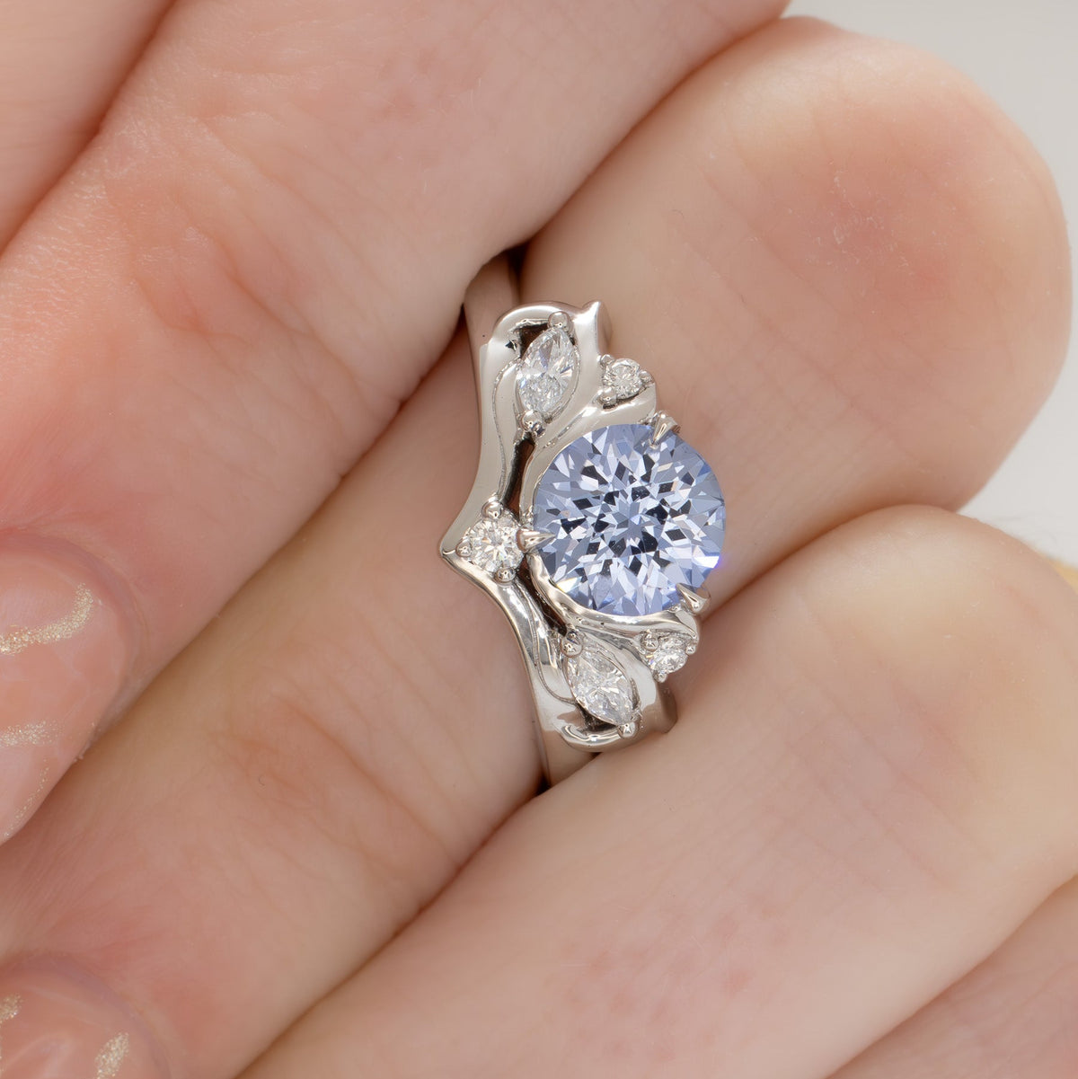 adira nature inspired ring in white gold with round light blue lab sapphire
