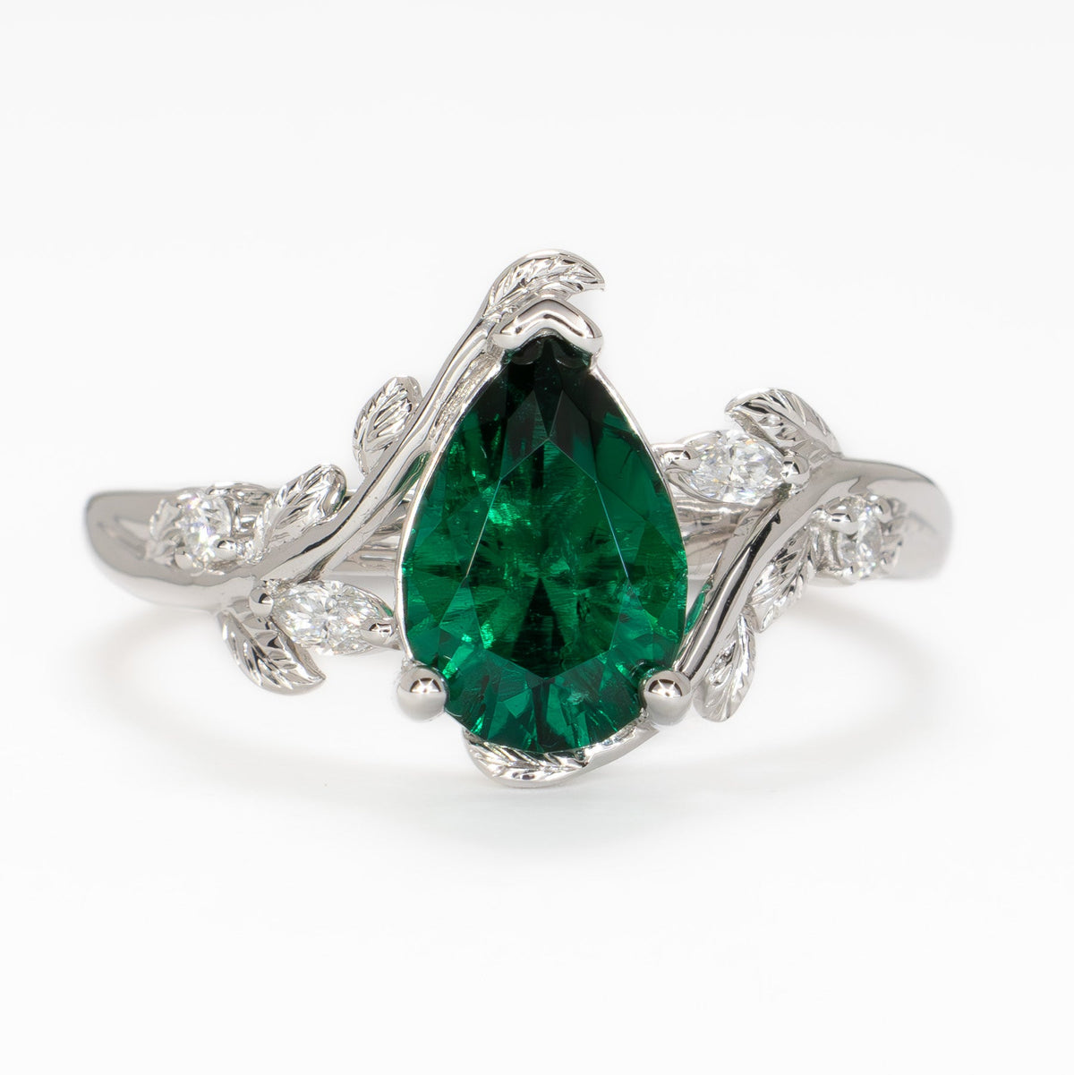 airam nature inspired ring in white gold with pear lab emerald