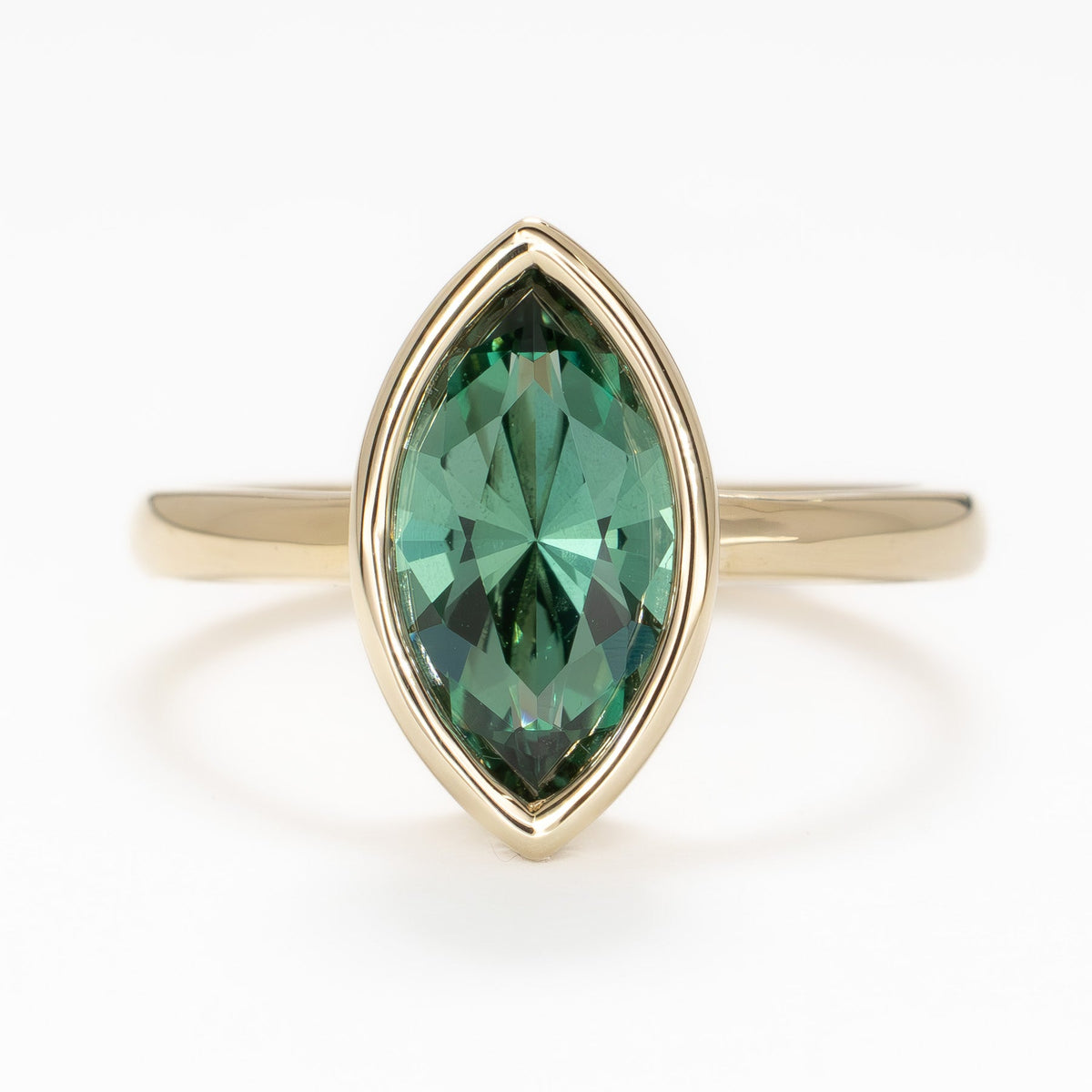 alexandra ring in yellow gold with marquise green lab sapphire