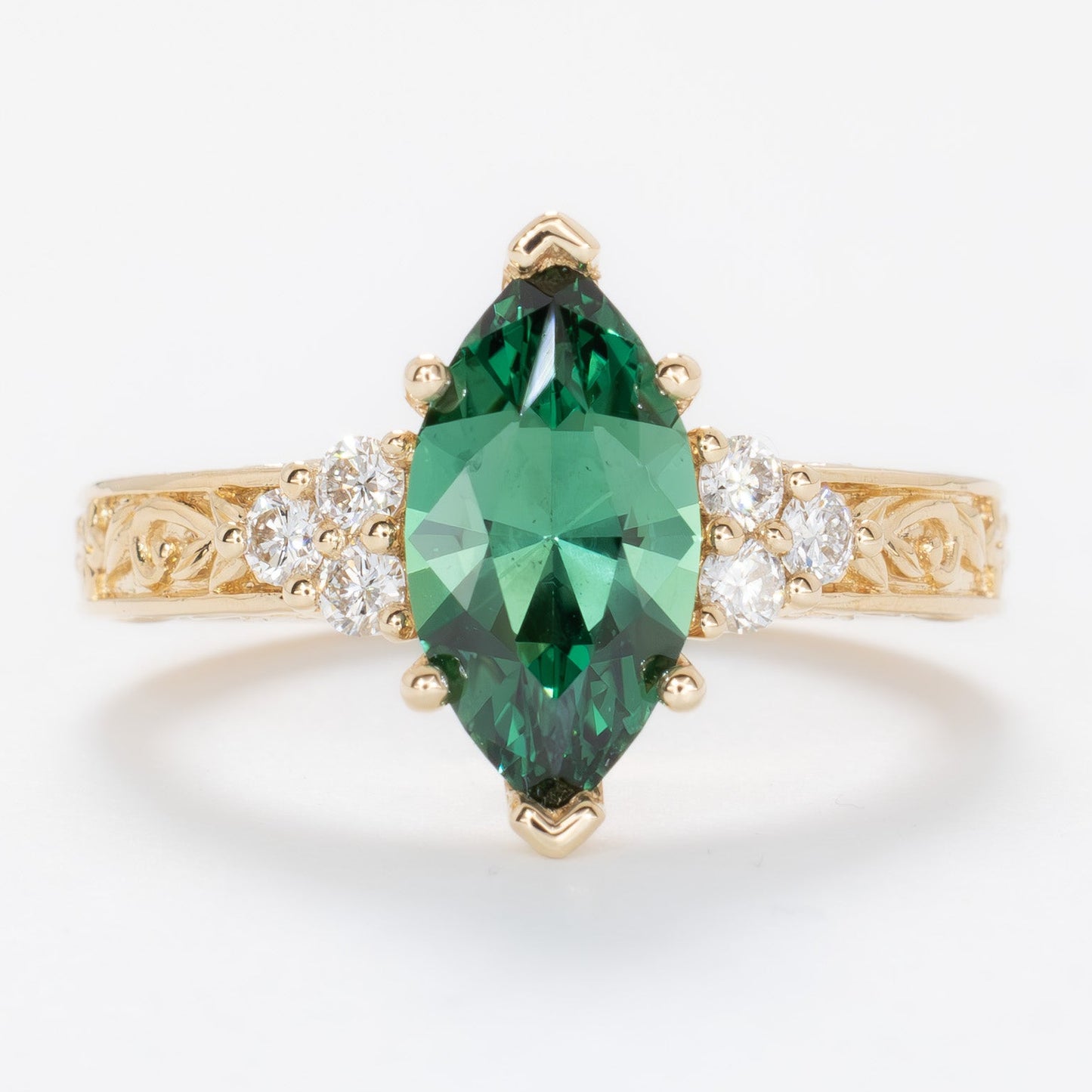 alice ring in yellow gold with a marquise green lab sapphire