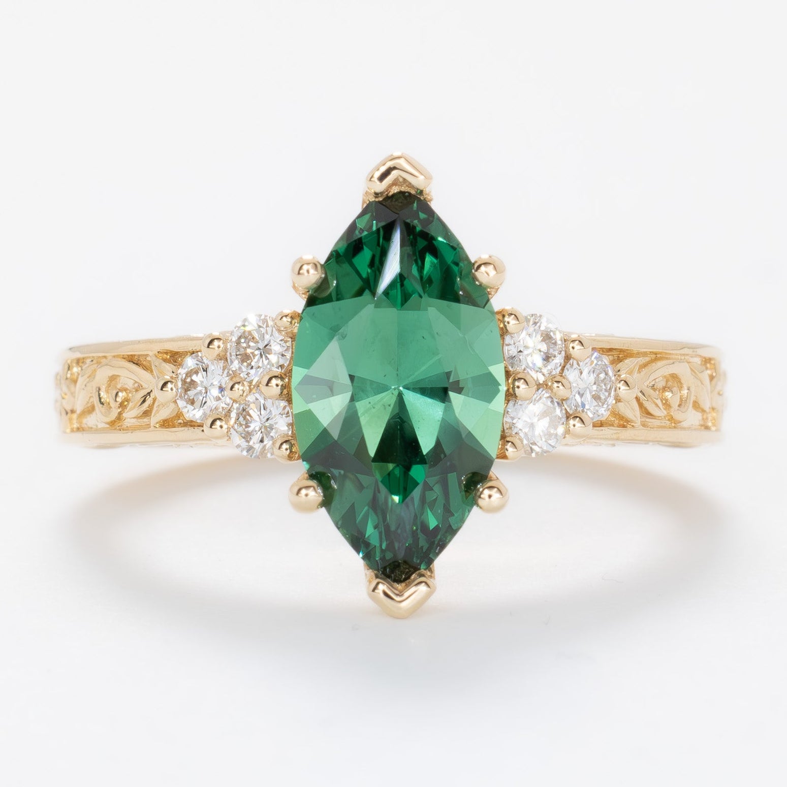 alice ring in yellow gold with a marquise green lab sapphire