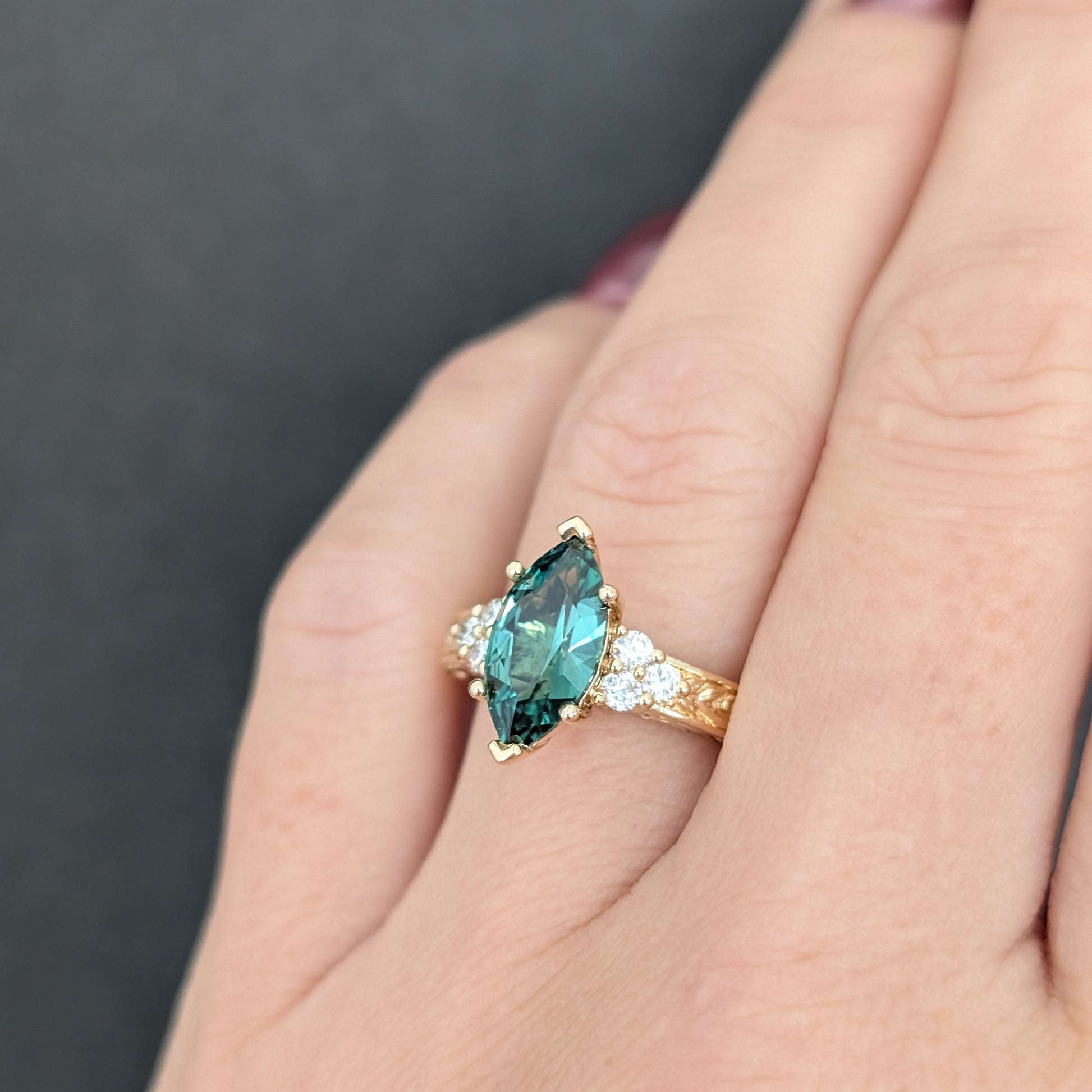 alice ring in yellow gold with a marquise green lab sapphire