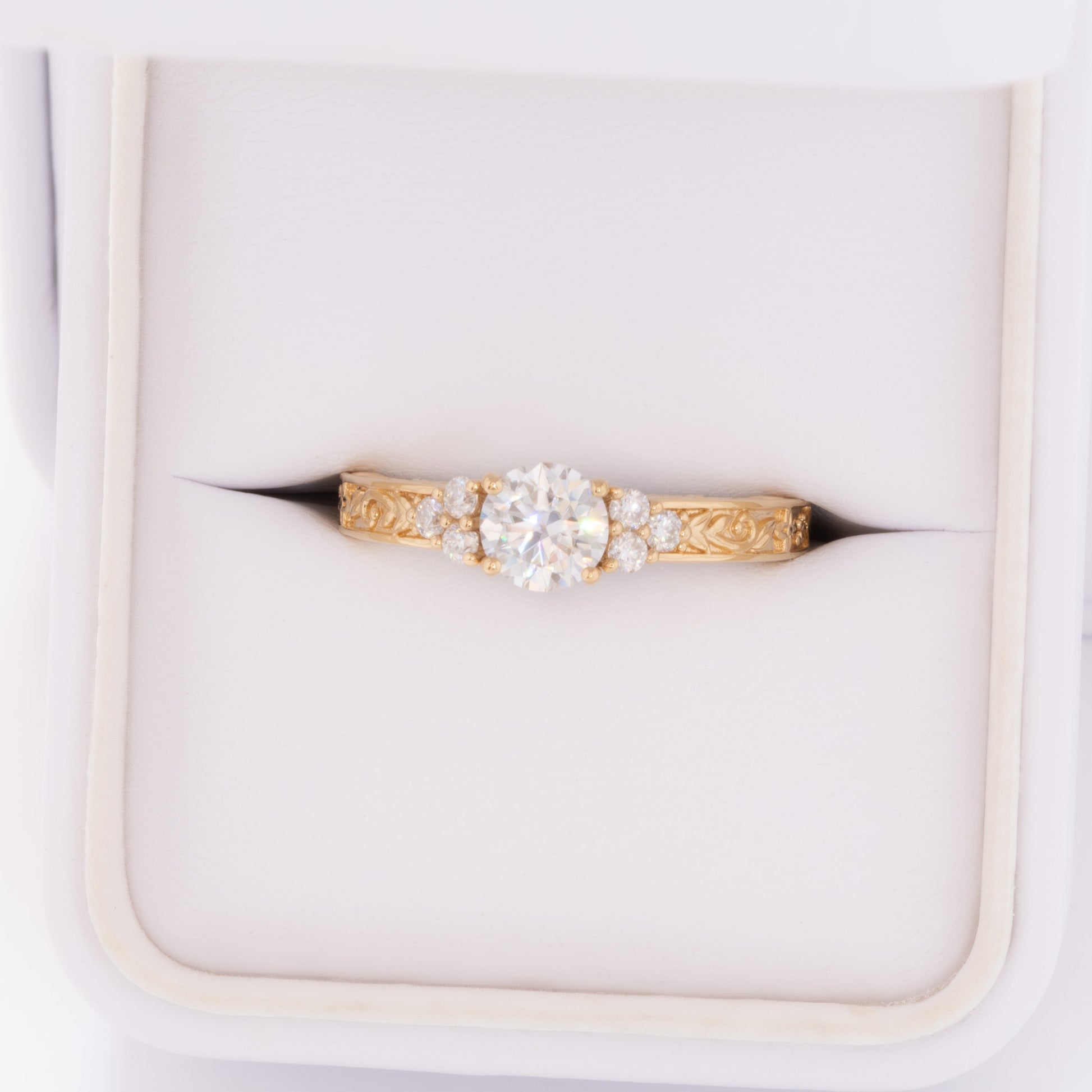 alice ring in yellow gold with round moissanite