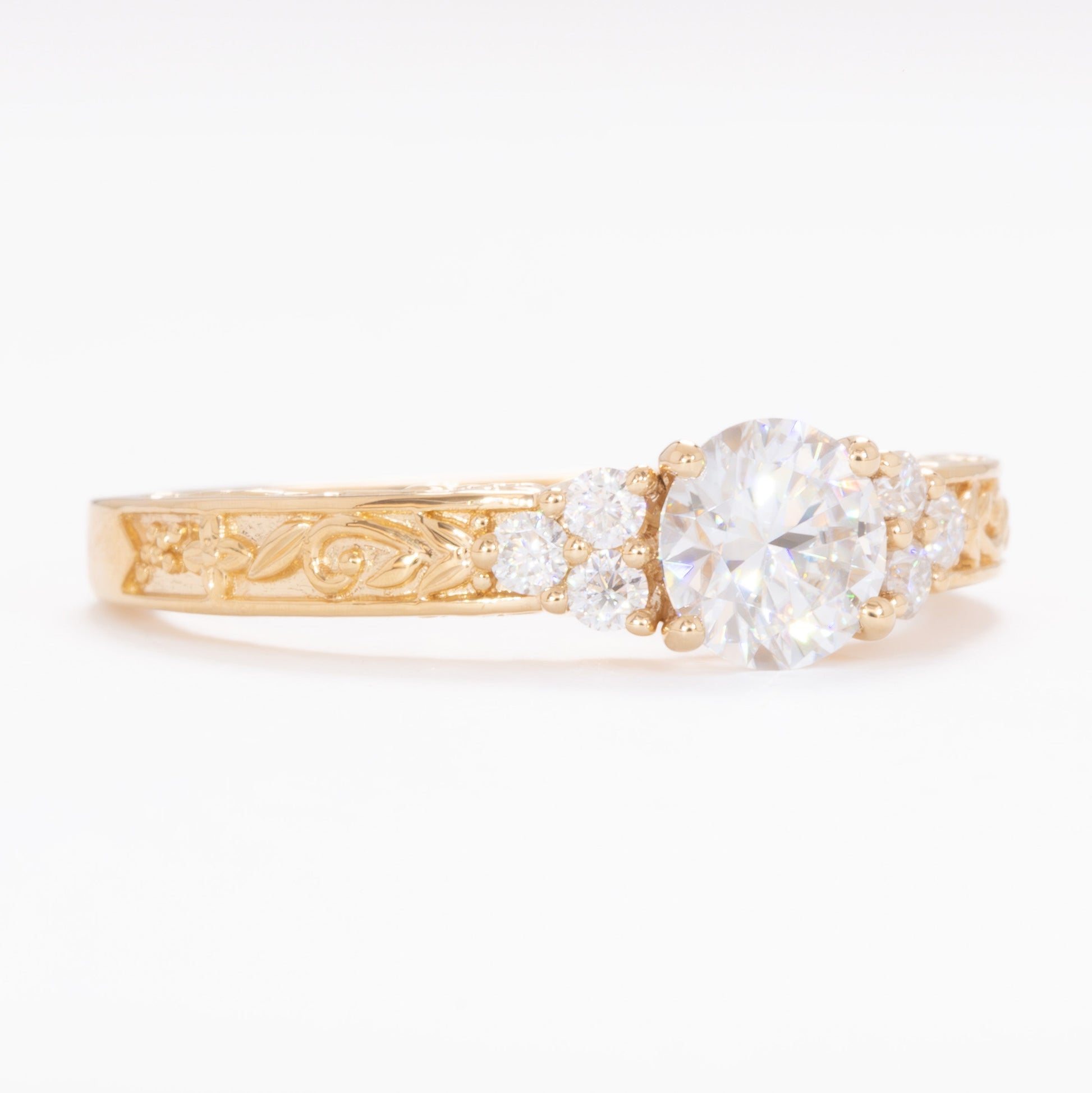 alice ring in yellow gold with round moissanite