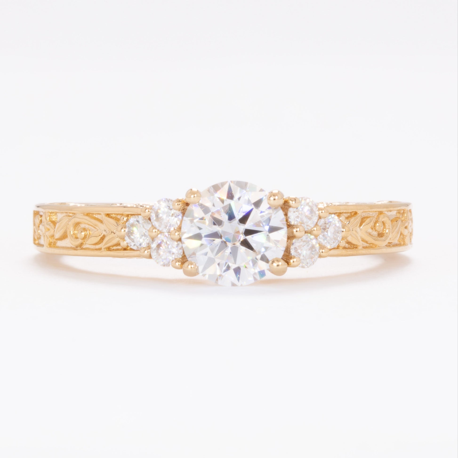 alice ring in yellow gold with round moissanite