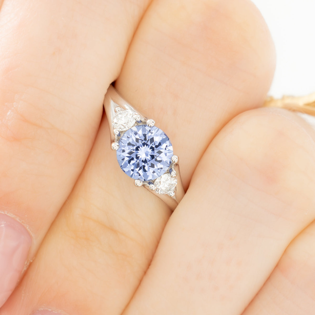 anastasia three stone ring in white gold with round periwinkle blue lab sapphire
