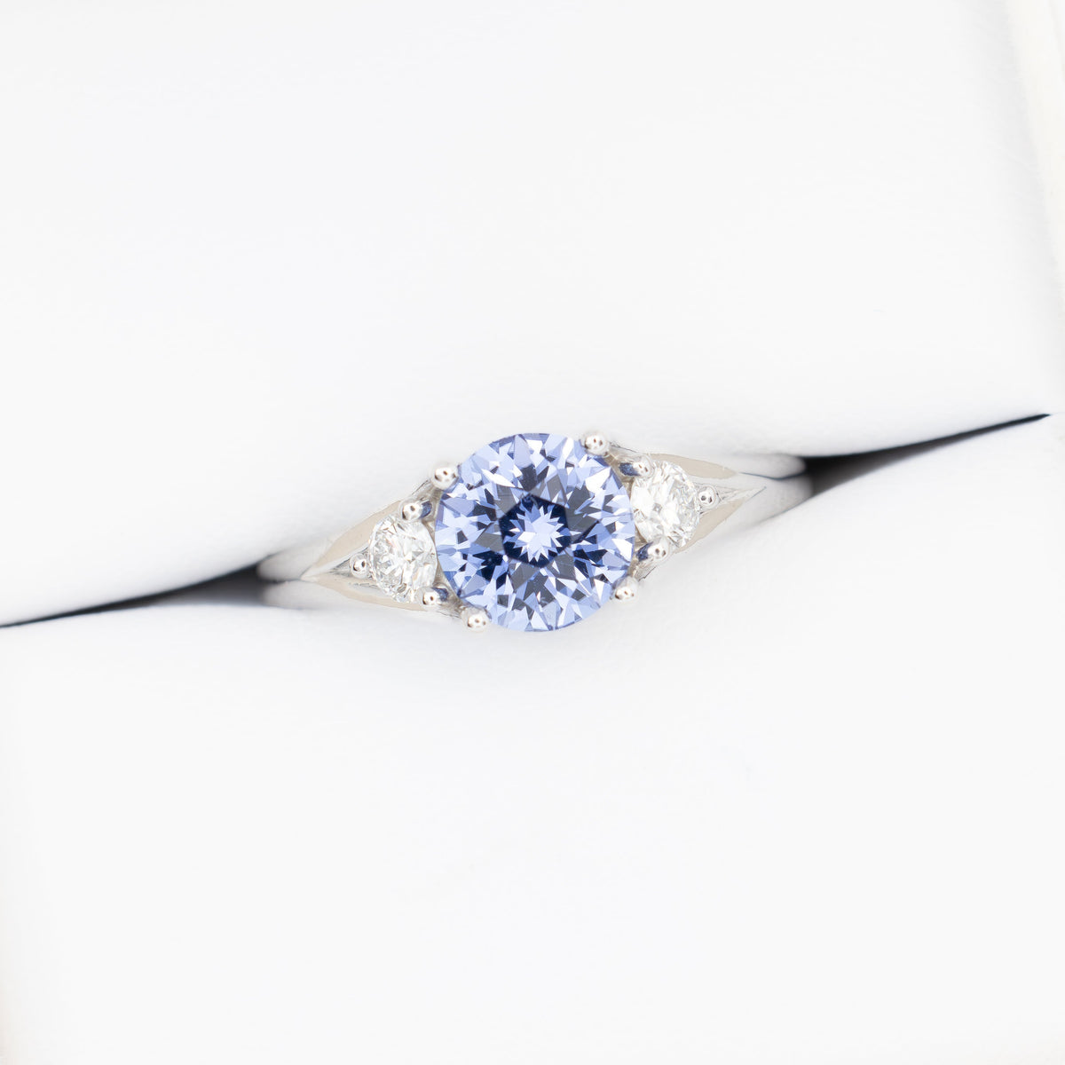 anastasia three stone ring in white gold with round periwinkle blue lab sapphire