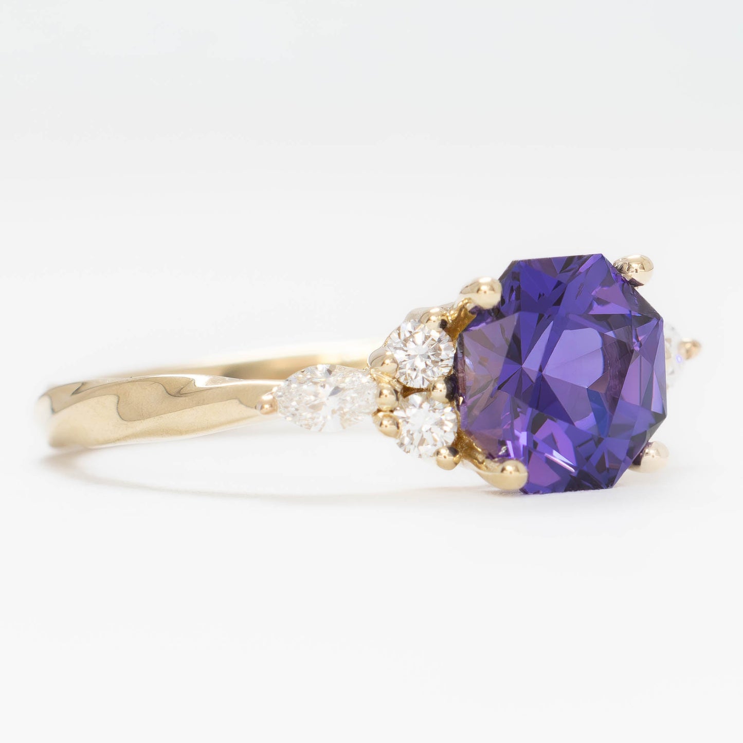ardene engagement ring with purple lab sapphire in yellow gold