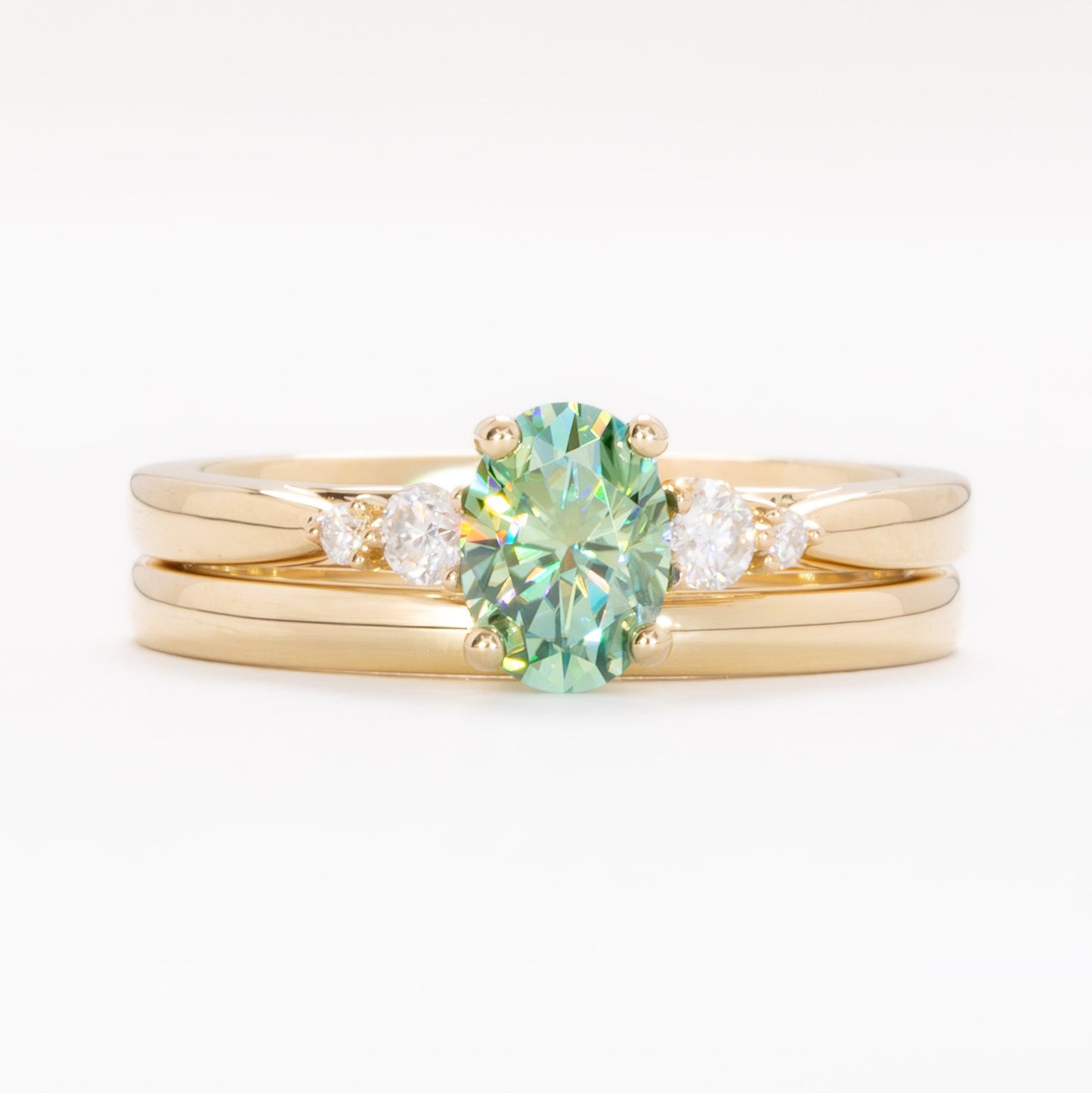 ariel wedding set with oval green moissanite