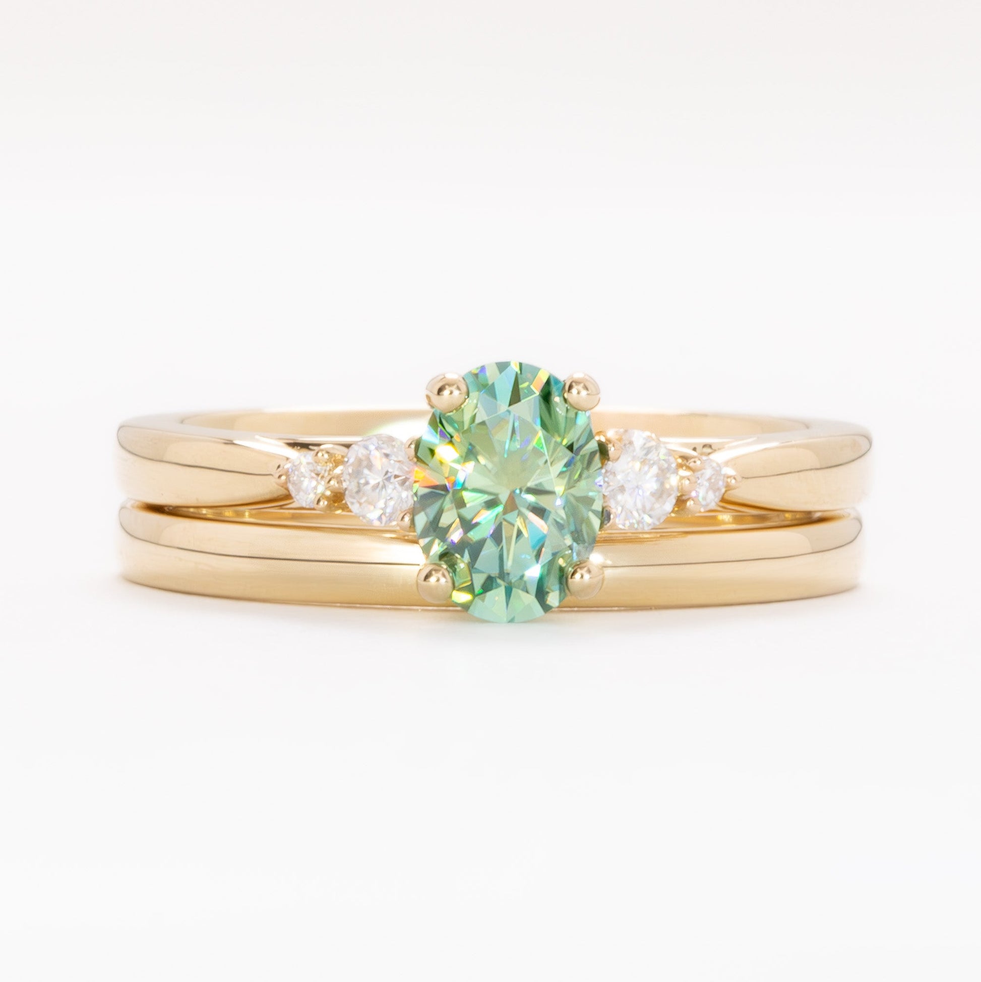 ariel wedding set with oval green moissanite