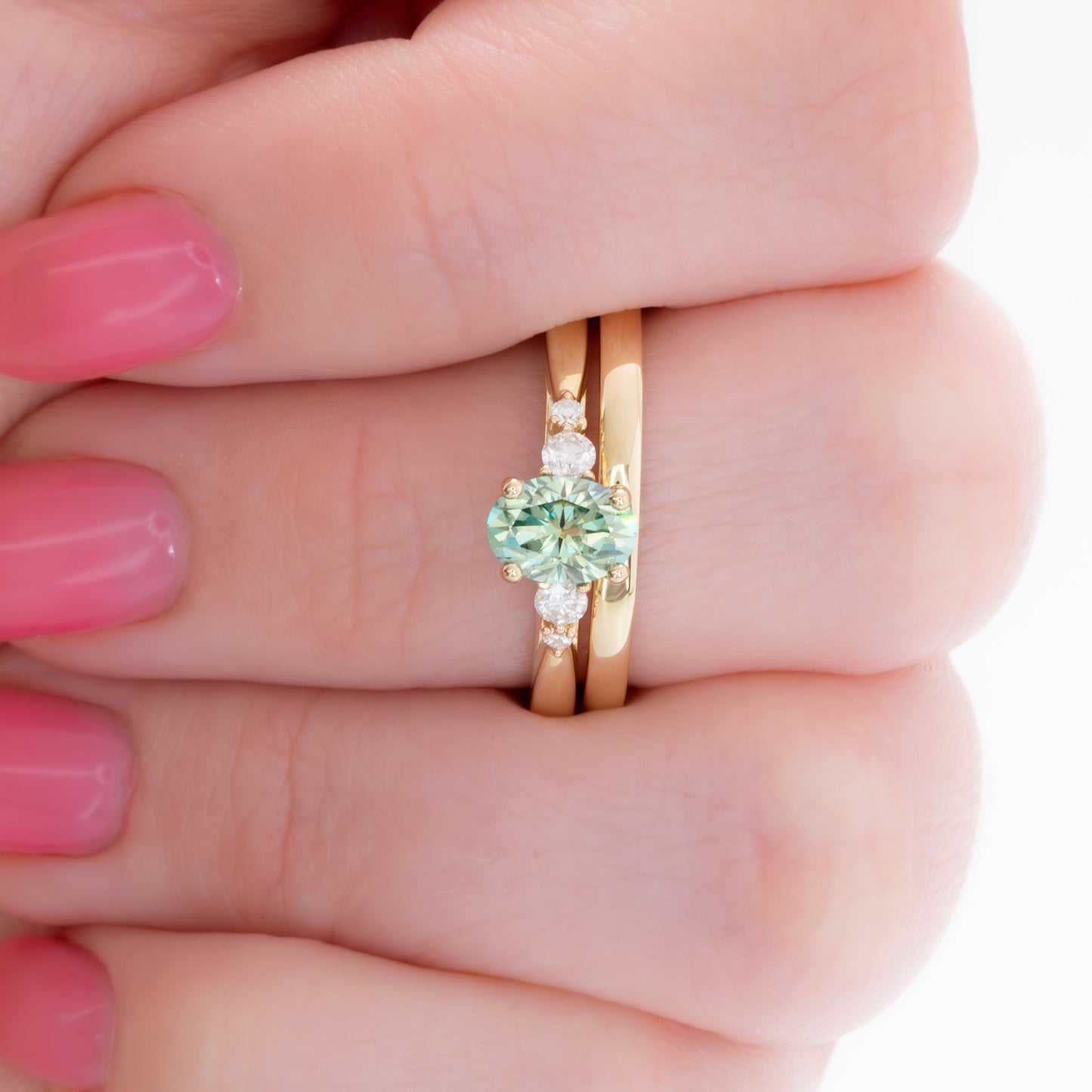 ariel wedding set with oval green moissanite