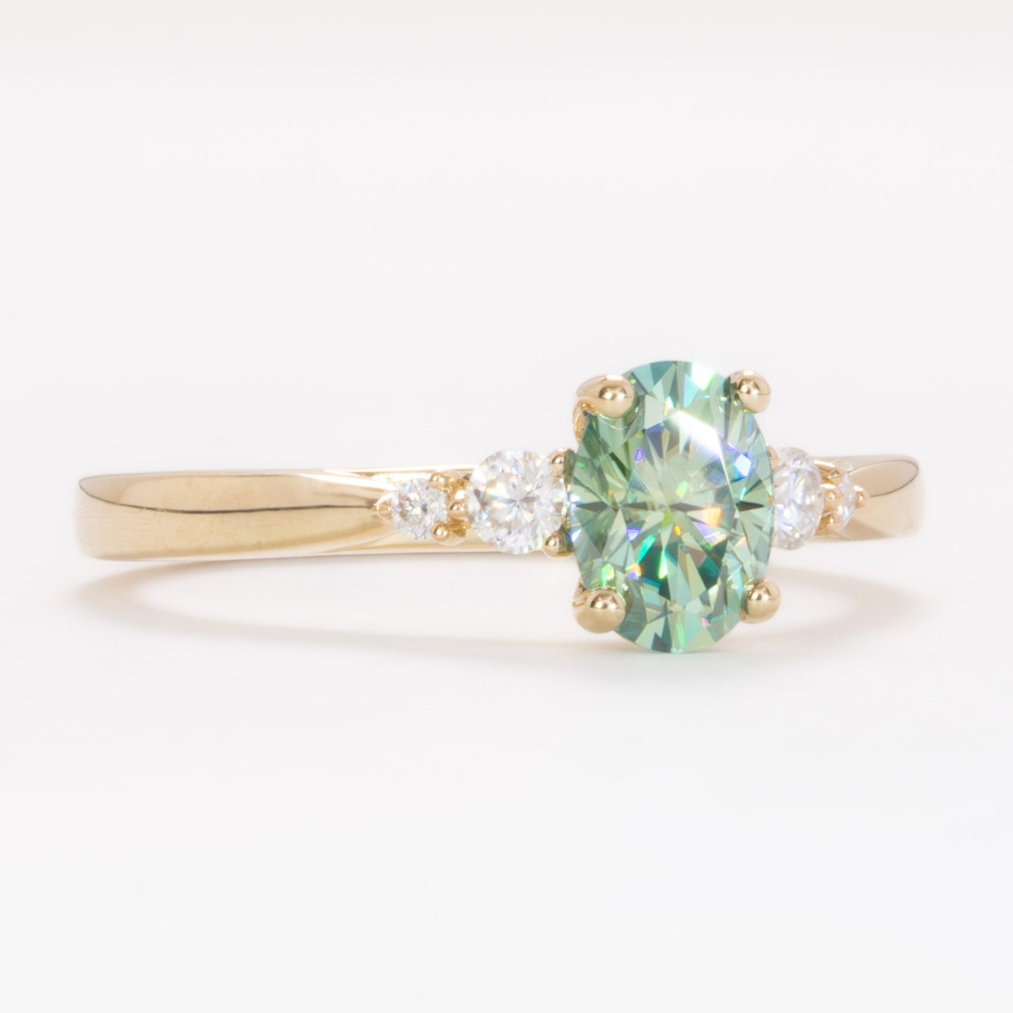 ariel wedding set with oval green moissanite