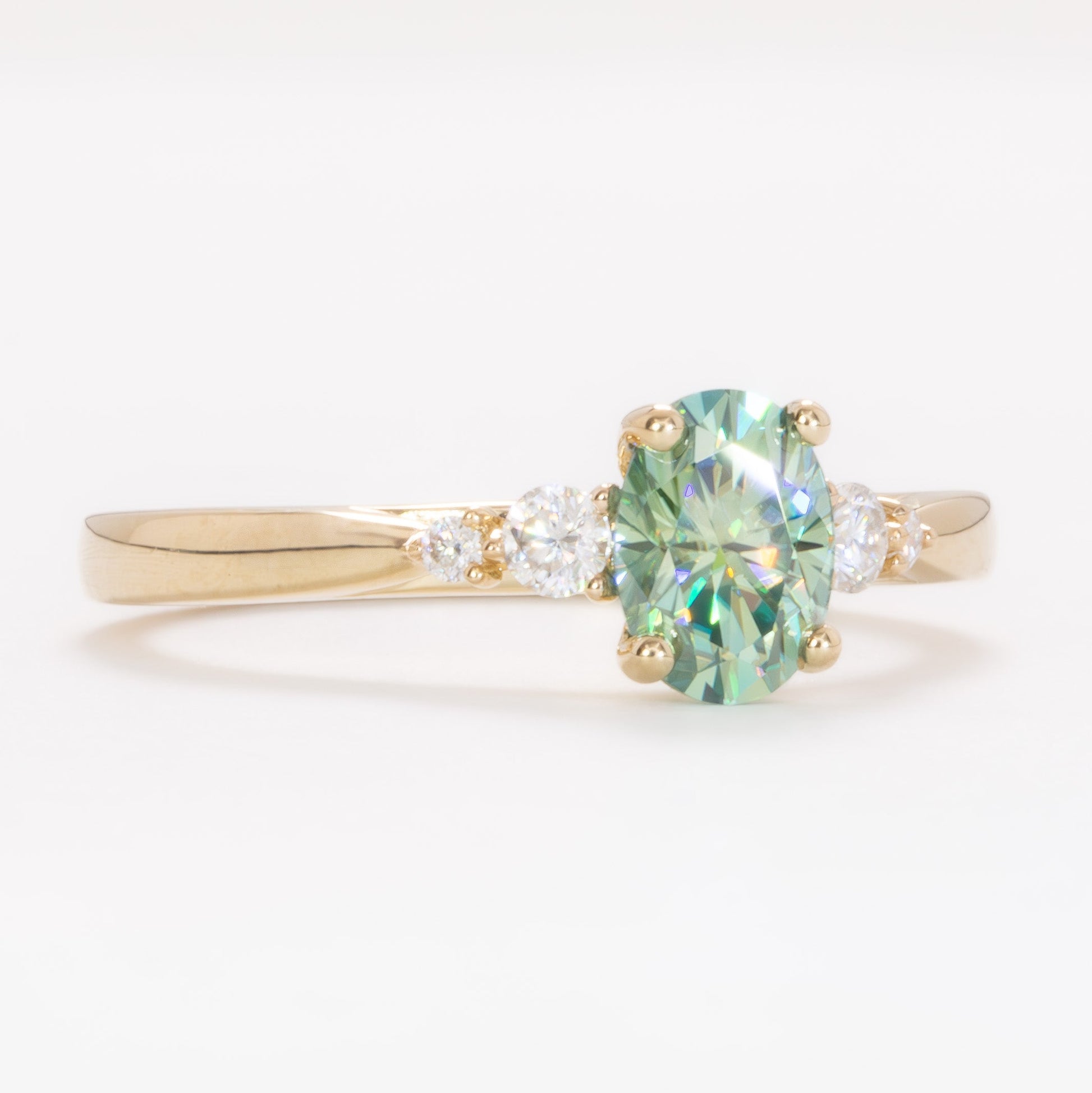 ariel wedding set with oval green moissanite