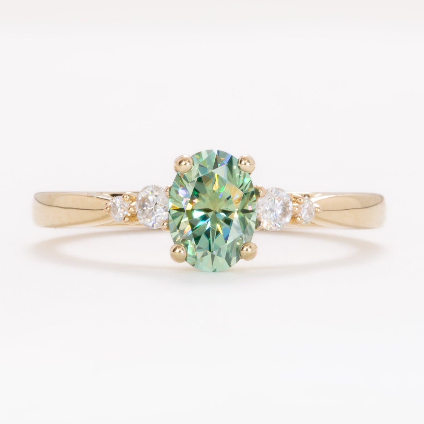 ariel wedding set with oval green moissanite