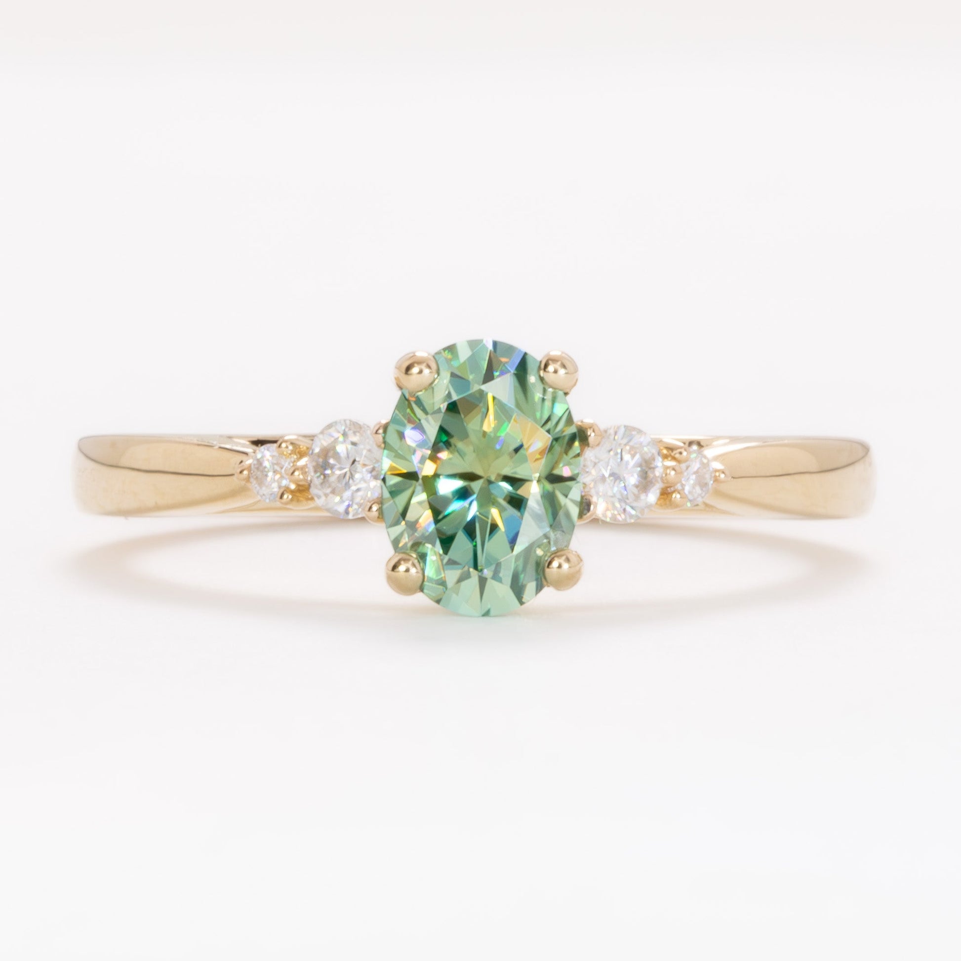 ariel wedding set with oval green moissanite