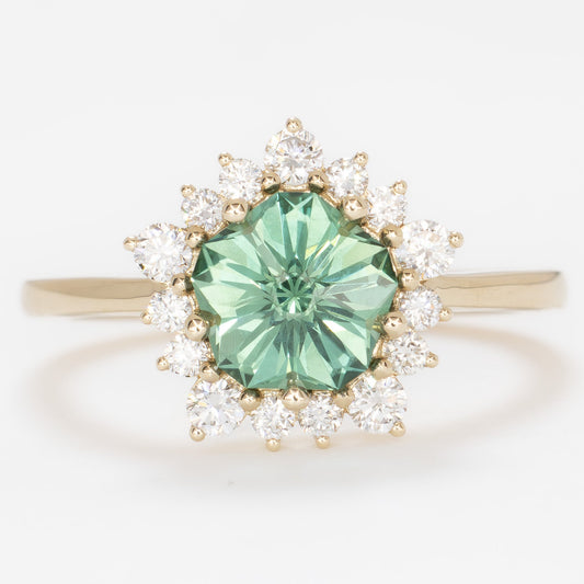 aurora snowflake inspired halo engagement ring with a green lab sapphire hanami pentagon