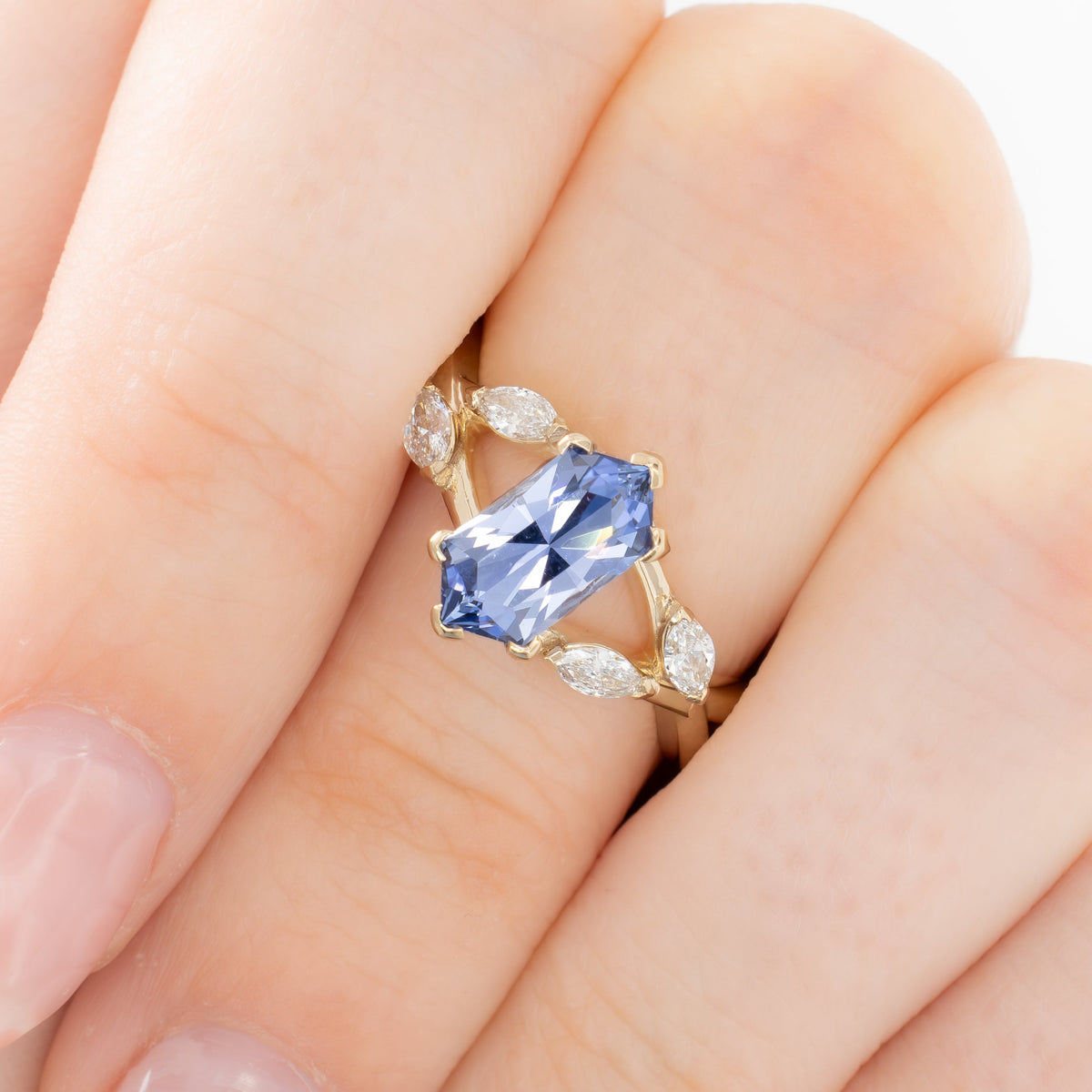 avani nature inspired ring in yellow gold with periwinkle blue lab sapphire dutch marquise