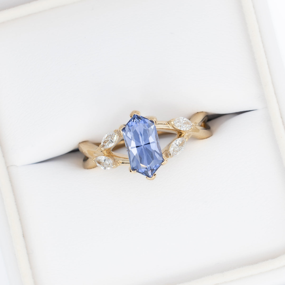 avani nature inspired ring in yellow gold with periwinkle blue lab sapphire dutch marquise