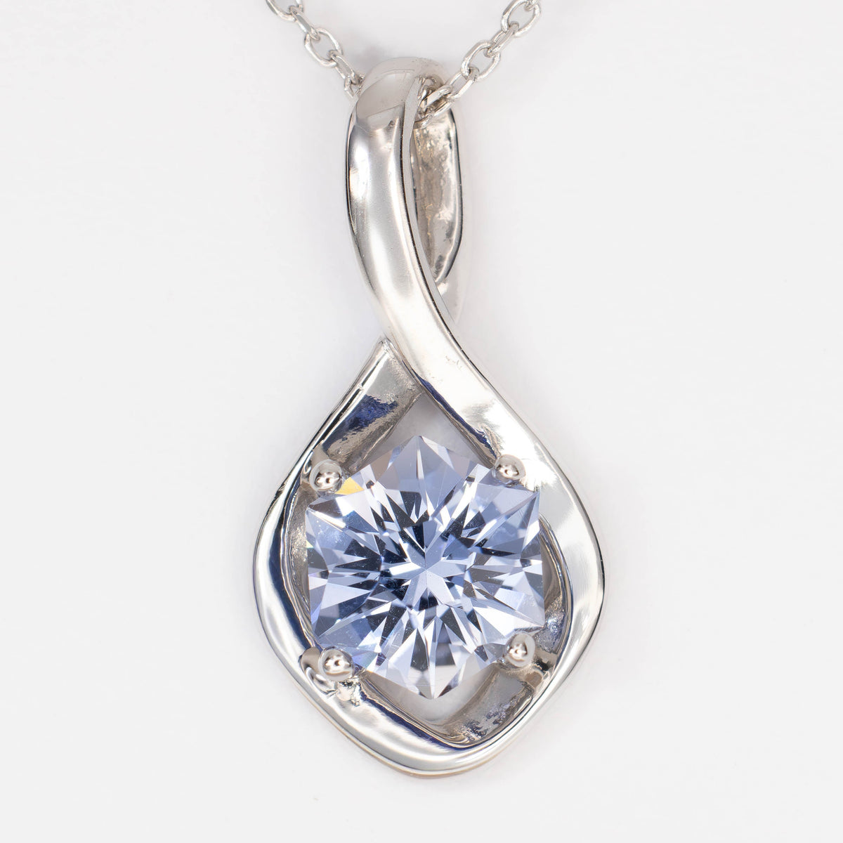 avdery infinity pendant in white gold with light blue lab sapphire hex