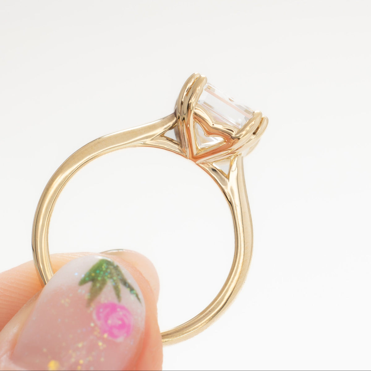 bailey solitaire ring in yellow gold with step cut white lab sapphire