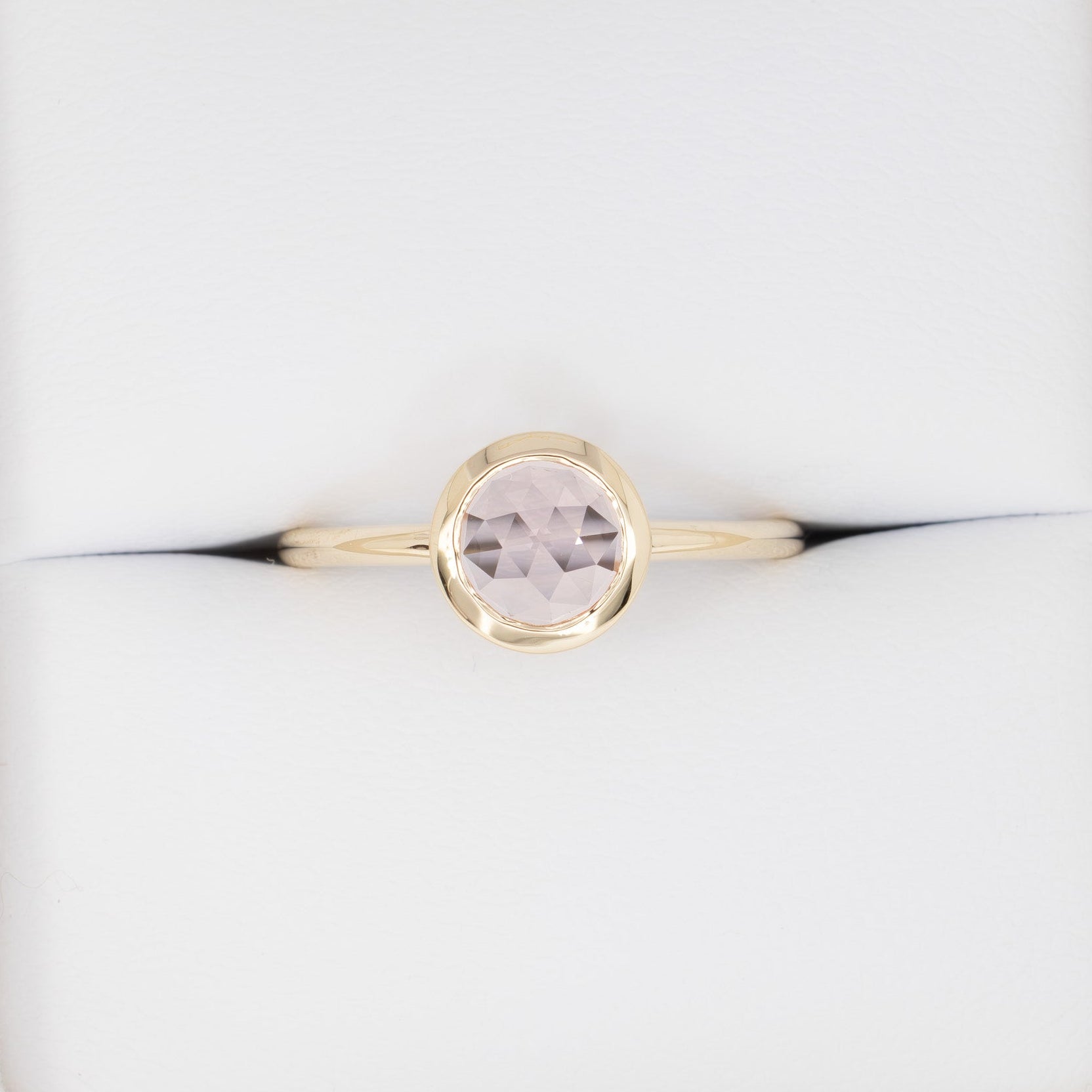 bezel set solitaire with rose cut pink lab sapphire
