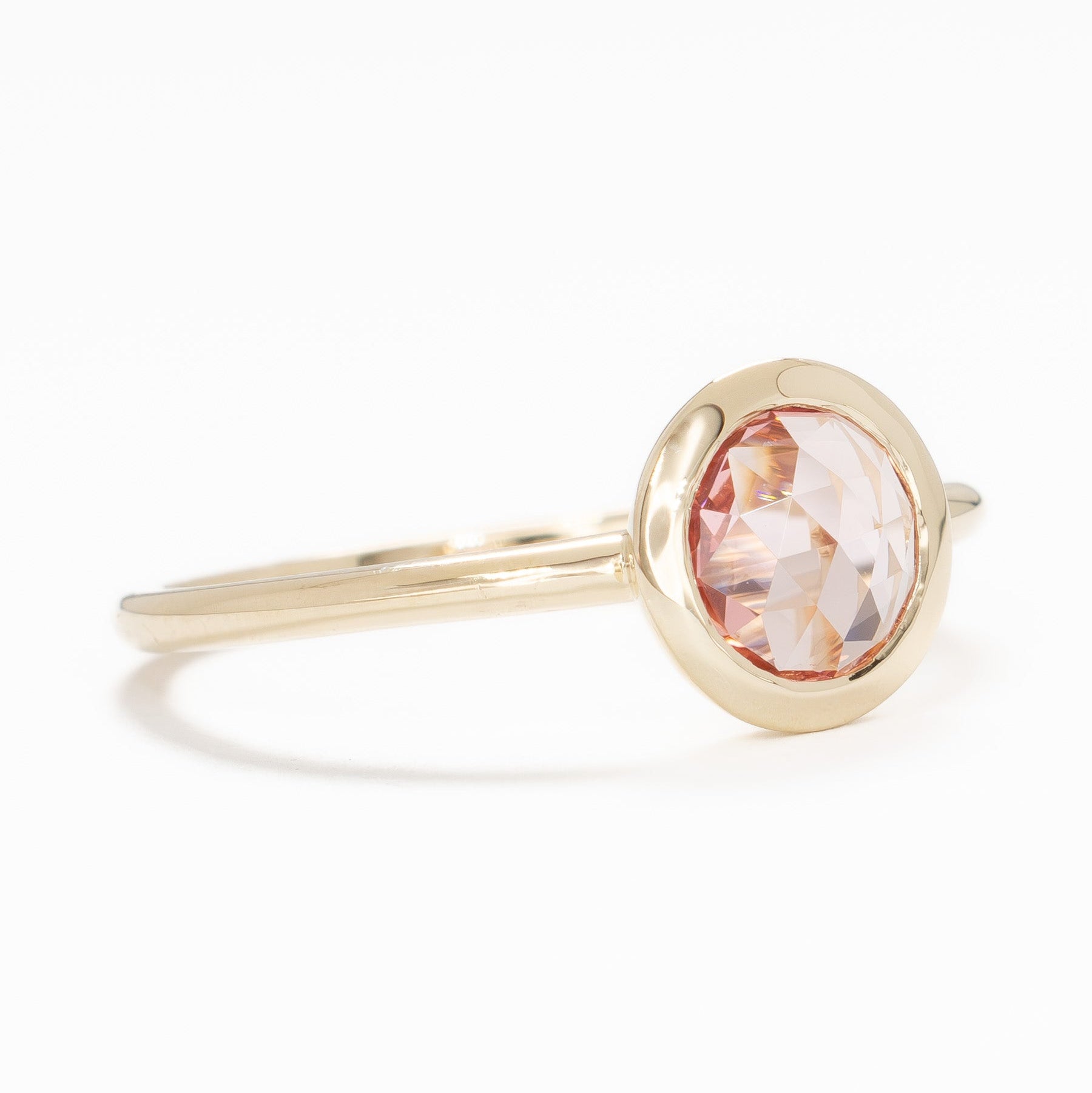 bezel set solitaire with rose cut pink lab sapphire