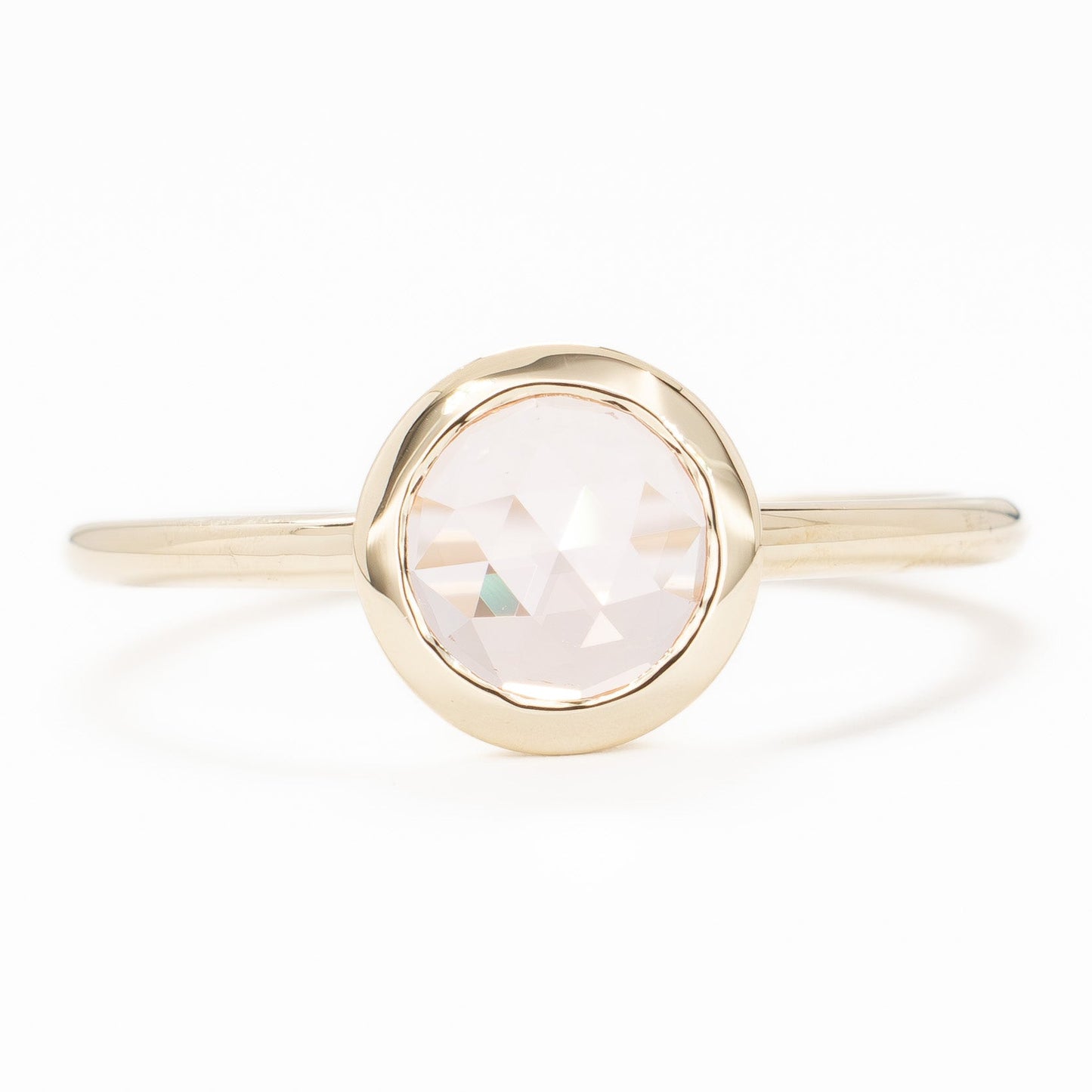 bezel set solitaire with rose cut pink lab sapphire