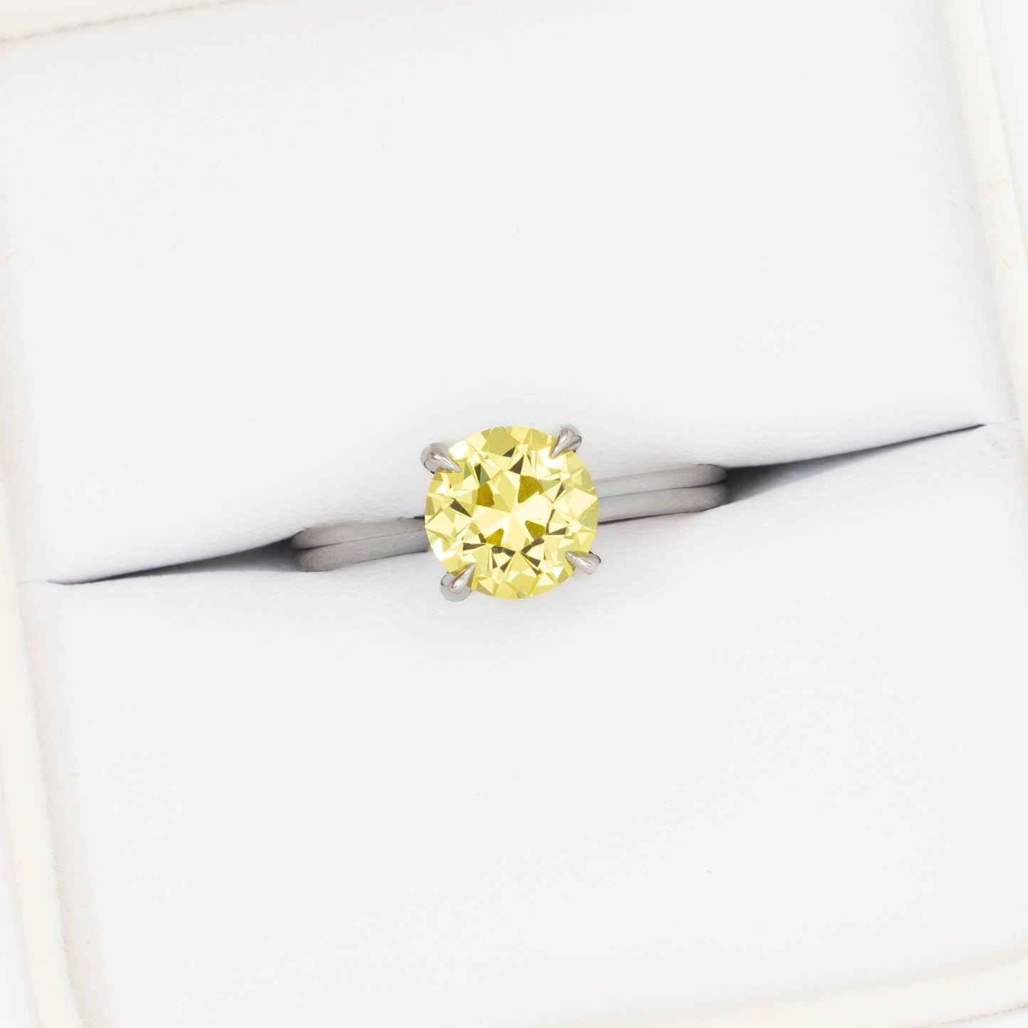 bree solitaire ring in white gold with round yellow lab sapphire
