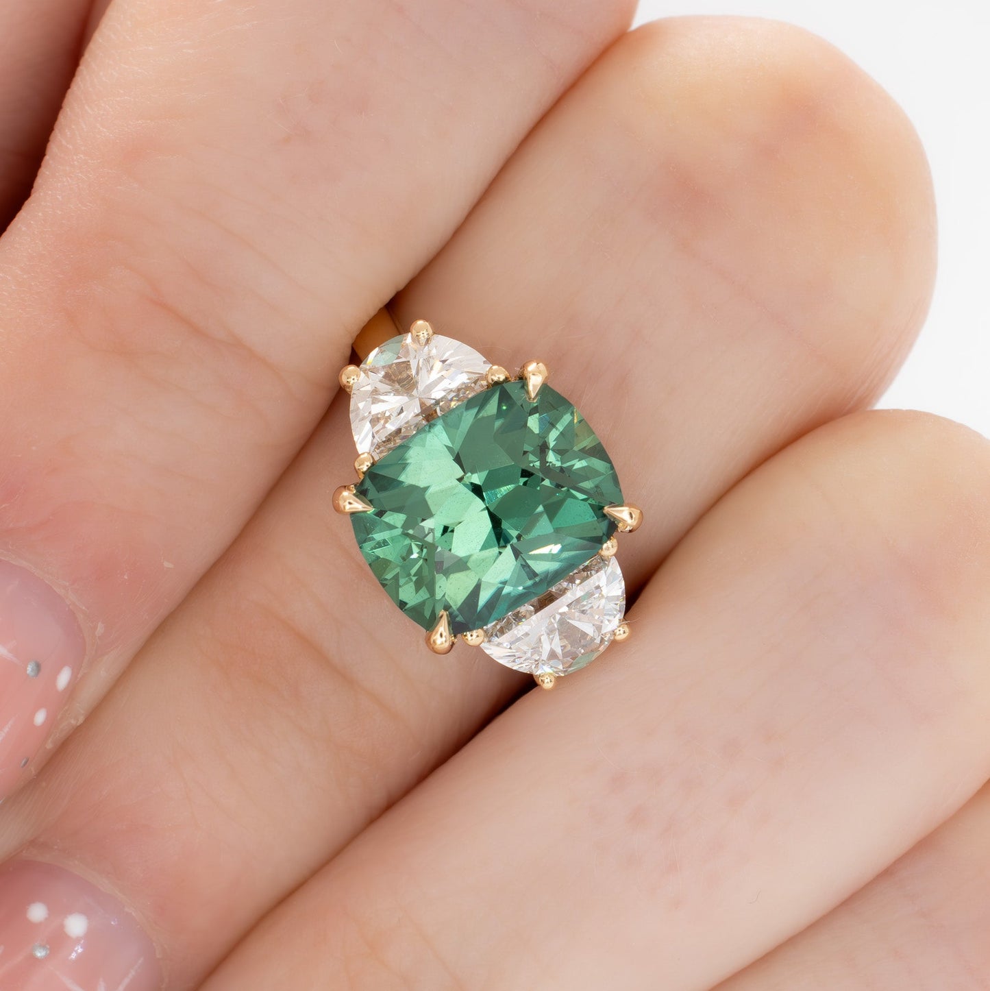 brigid half moon three stone engagement ring with elongated cushion green lab sapphire