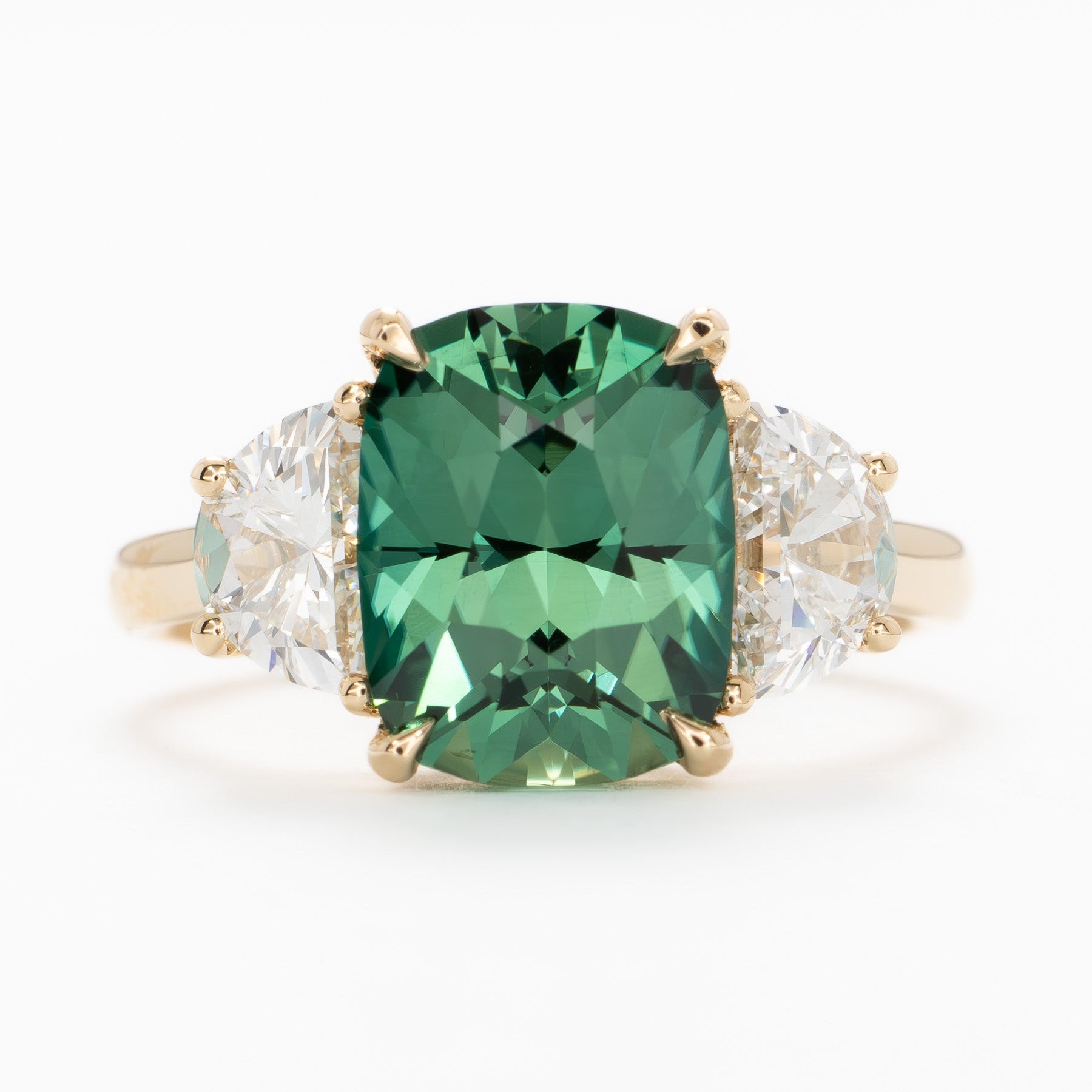 brigid half moon three stone engagement ring with elongated cushion green lab sapphire