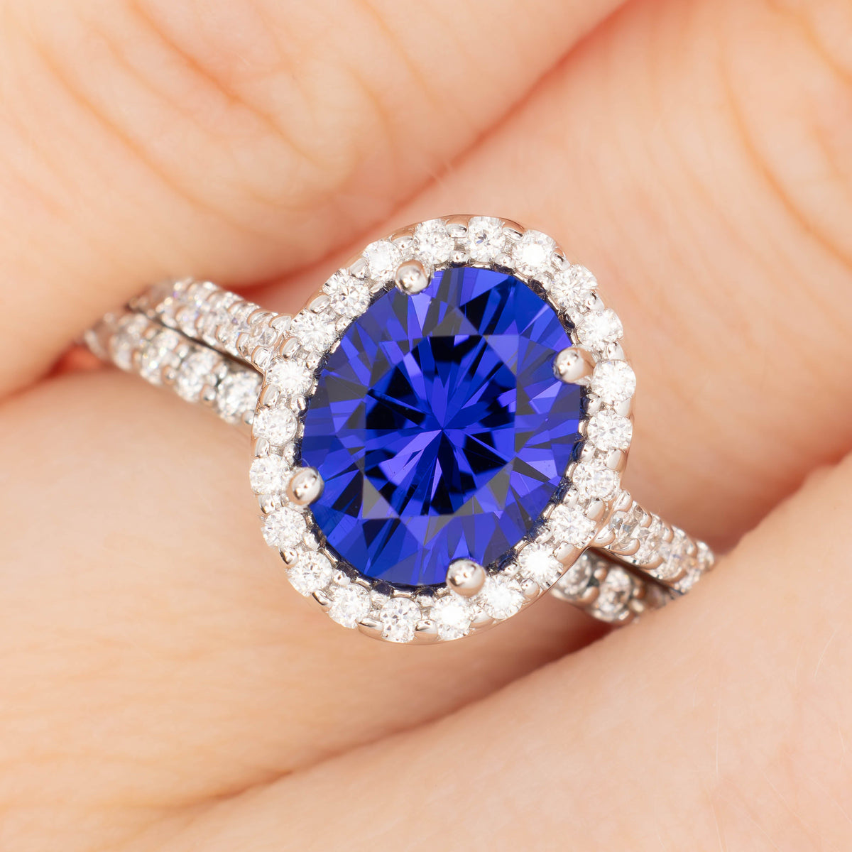 brynn halo ring in white gold with oval royal blue lab sapphire