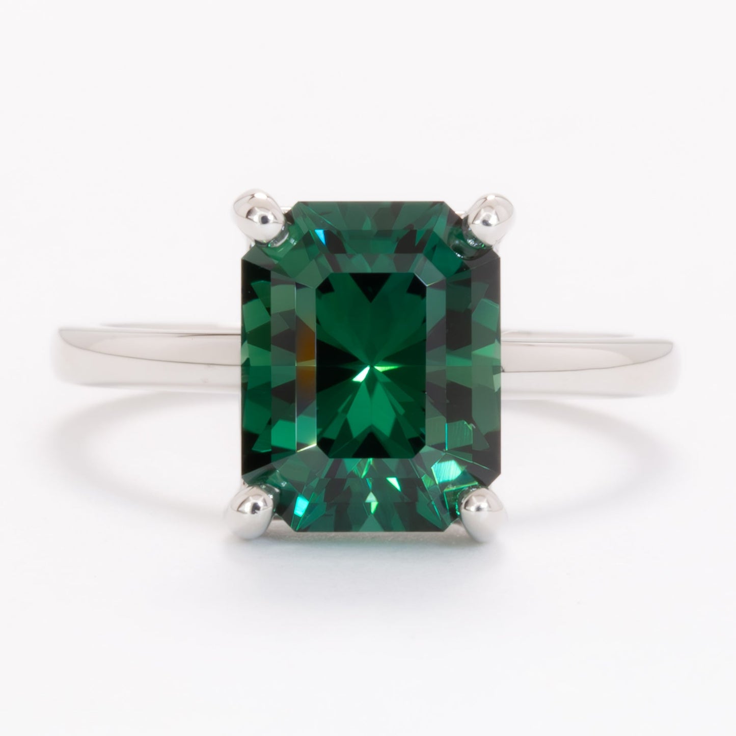 cali solitaire ring with radiant green lab sapphire