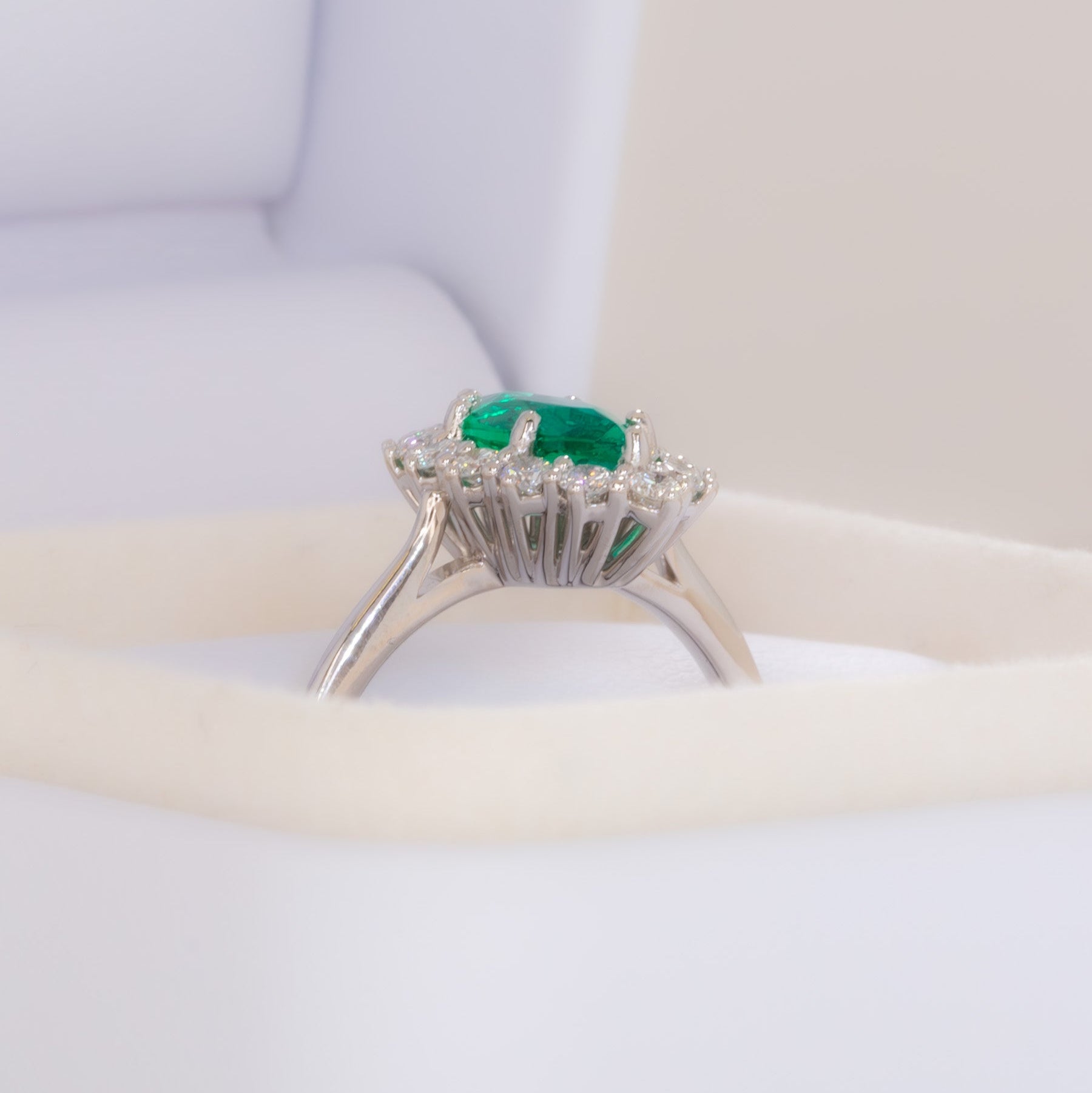 calypso halo engagement ring in white gold and marquise lab emerald