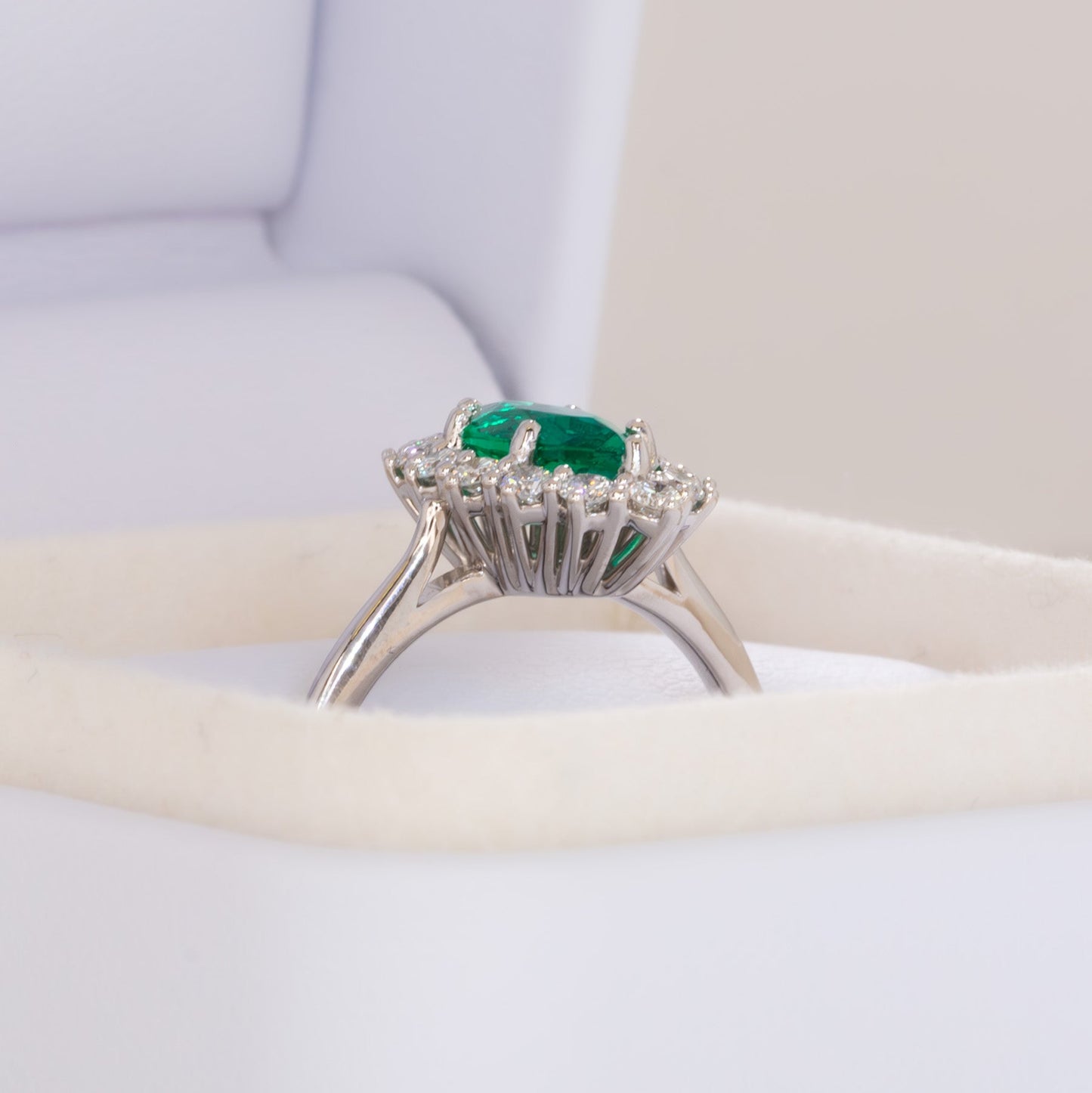 calypso halo engagement ring with emerald marquise