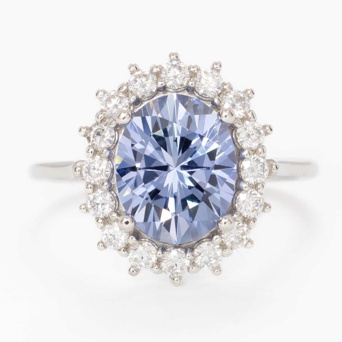 calypso halo engagement ring with oval blue lab sapphire