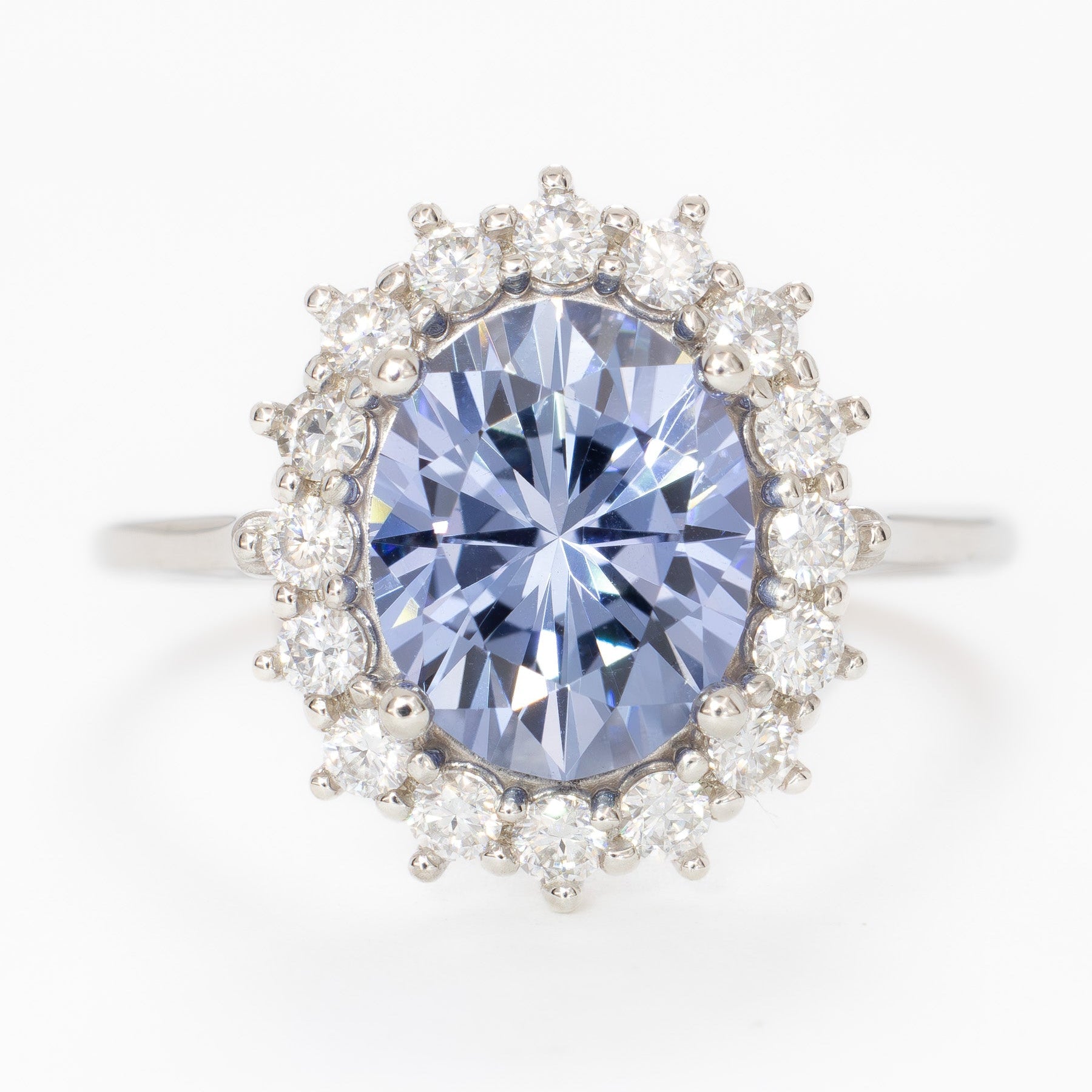 calypso halo engagement ring with oval blue lab sapphire