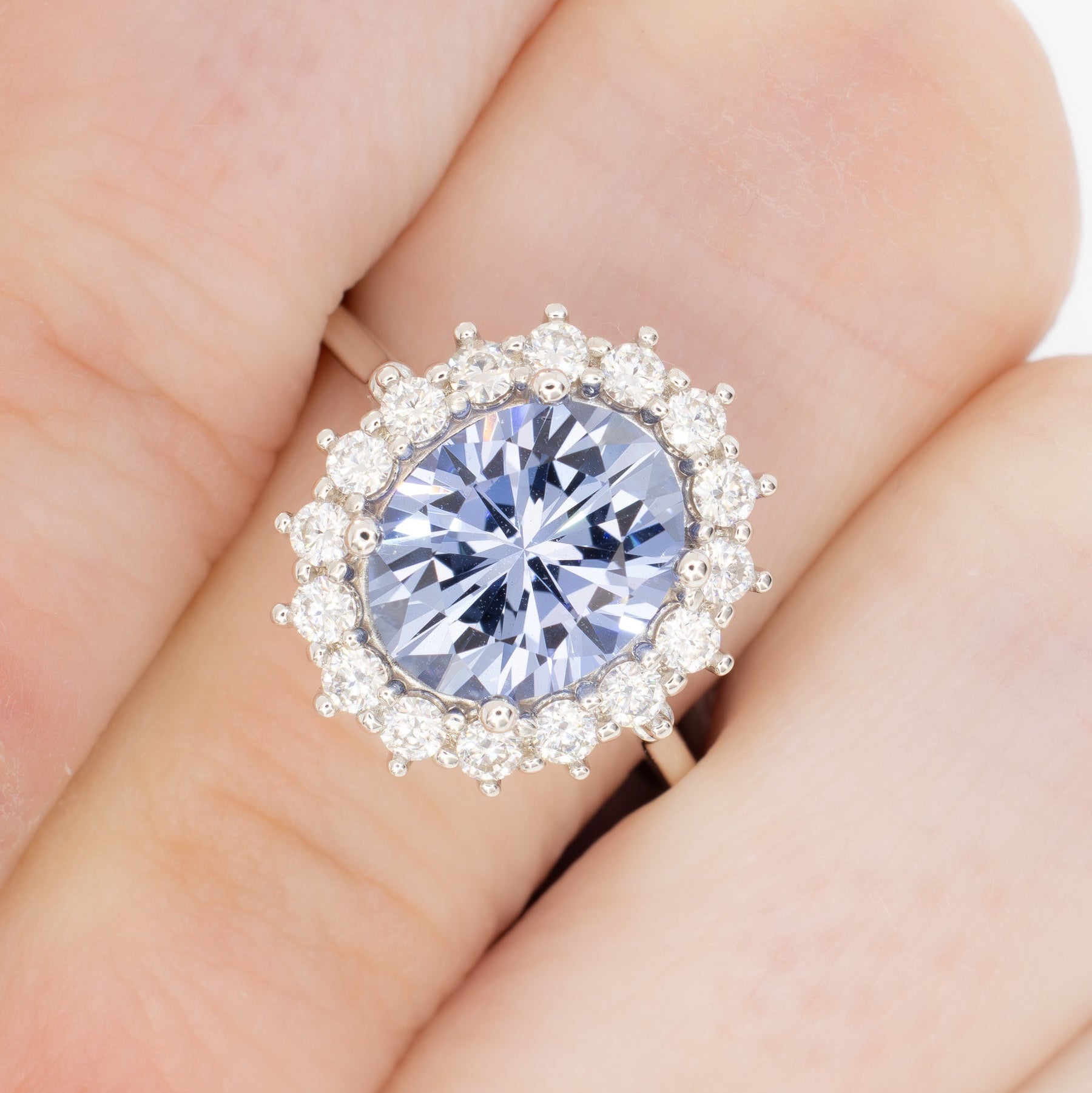 calypso halo engagement ring with oval blue lab sapphire