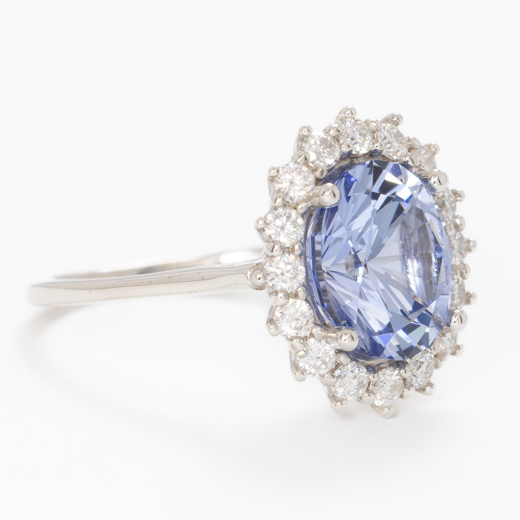calypso halo engagement ring with oval blue lab sapphire
