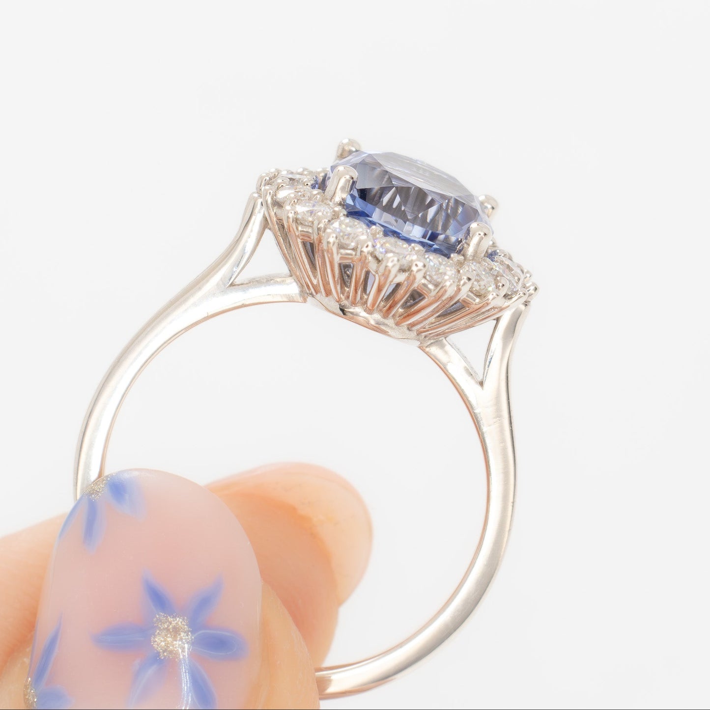 calypso halo engagement ring with oval blue lab sapphire