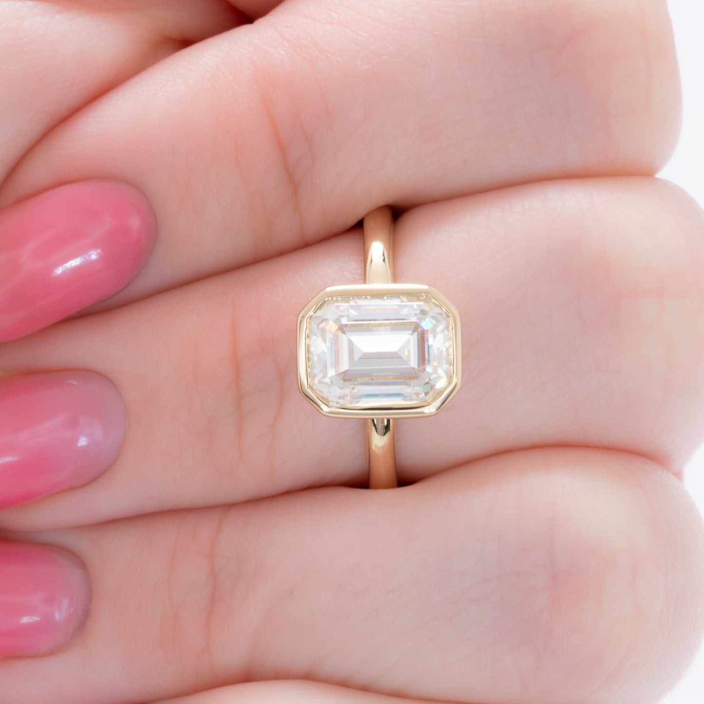 cami bezel set solitaire with step cut moissanite