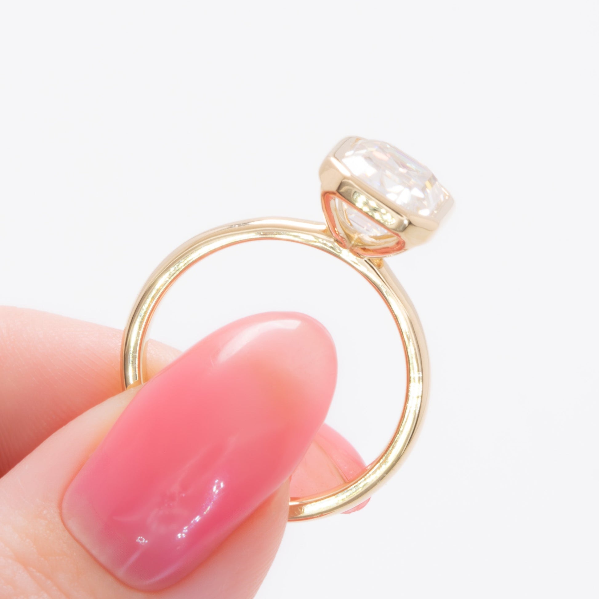 cami bezel set solitaire with step cut moissanite