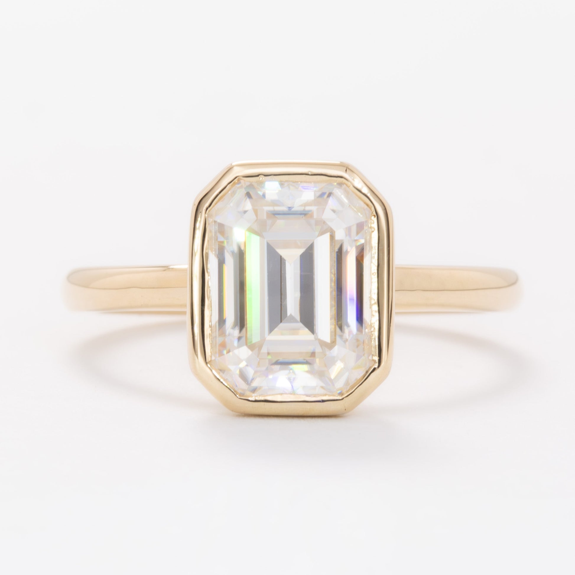 cami bezel set solitaire with step cut moissanite