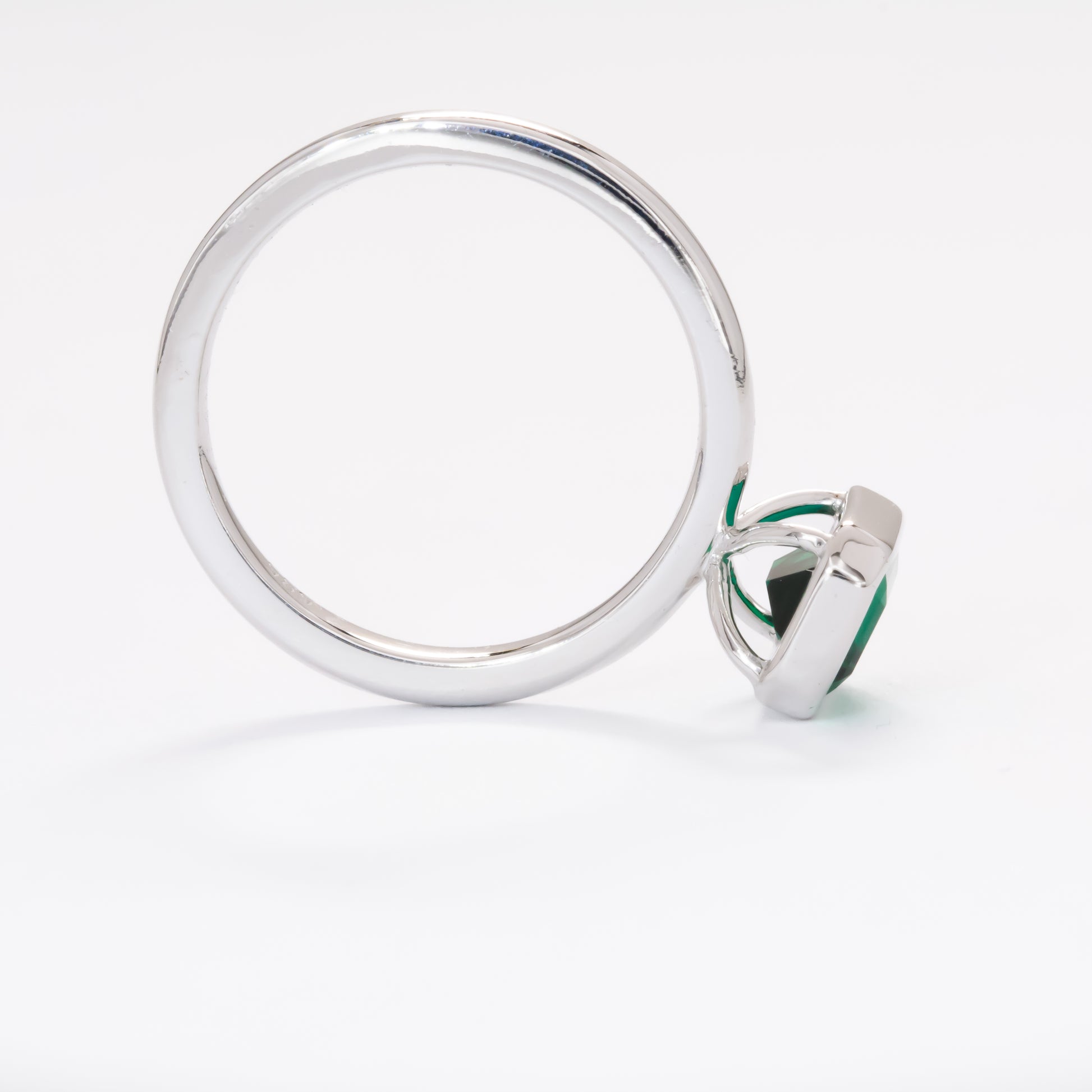cami engagement ring with lab emerald step cut