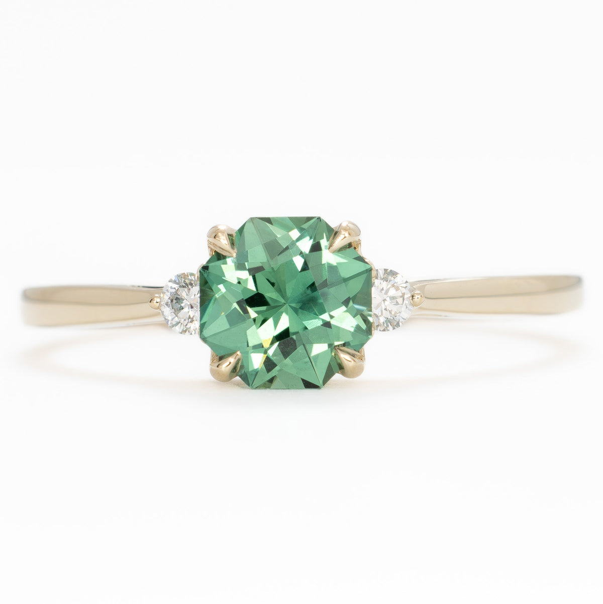 carina three stone ring in yellow gold with octagonal cut hidden princess green lab sapphire