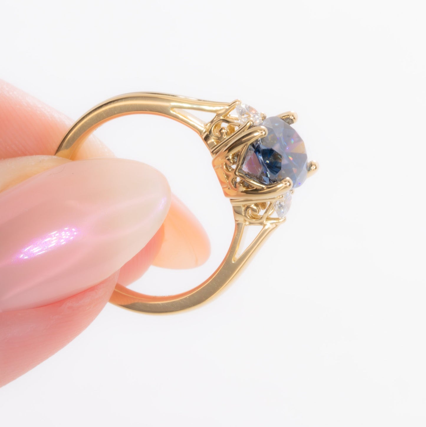 carina three stone ring with blue moissanite oval