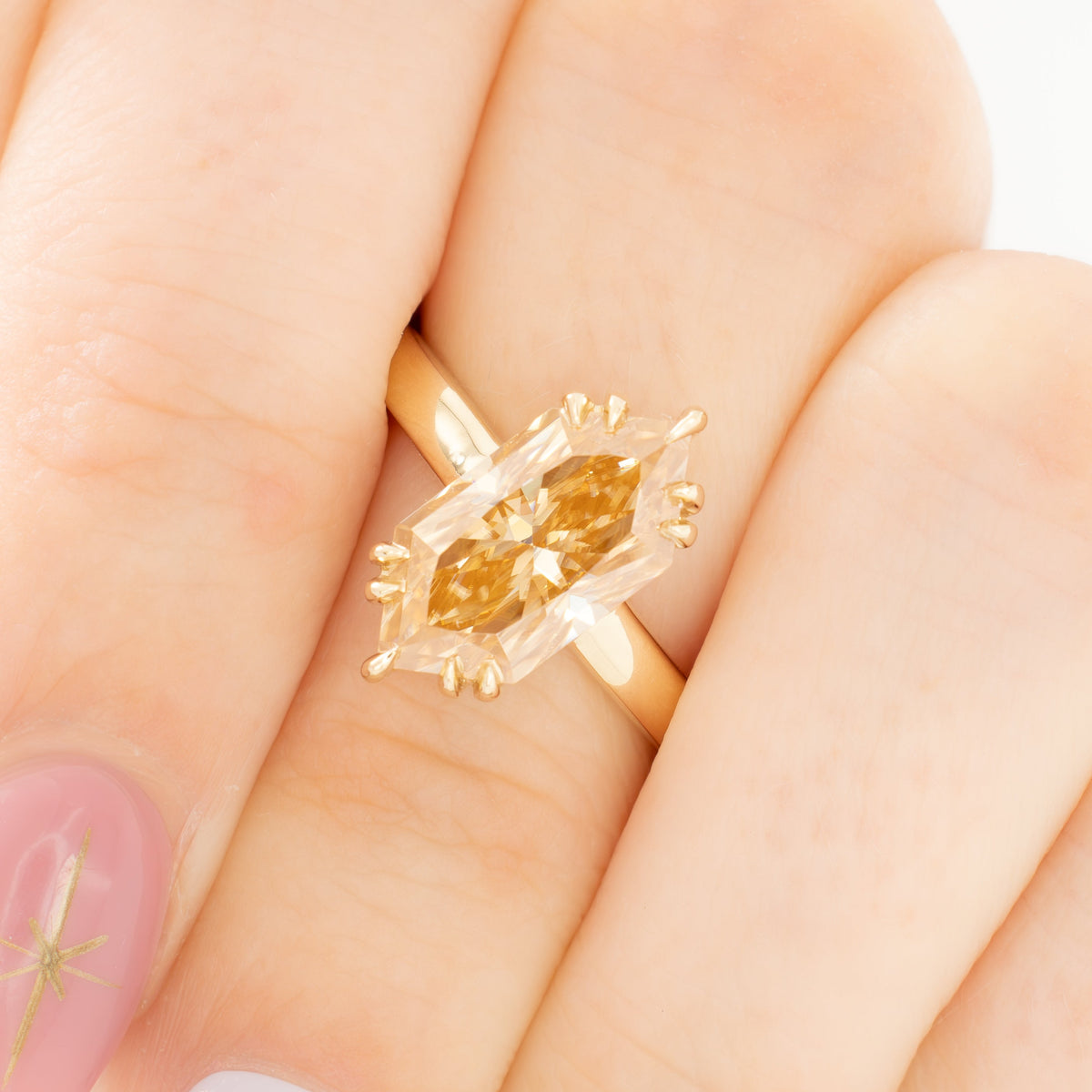 chandra solitaire ring in yellow gold with champagne dutch marquise moissanite