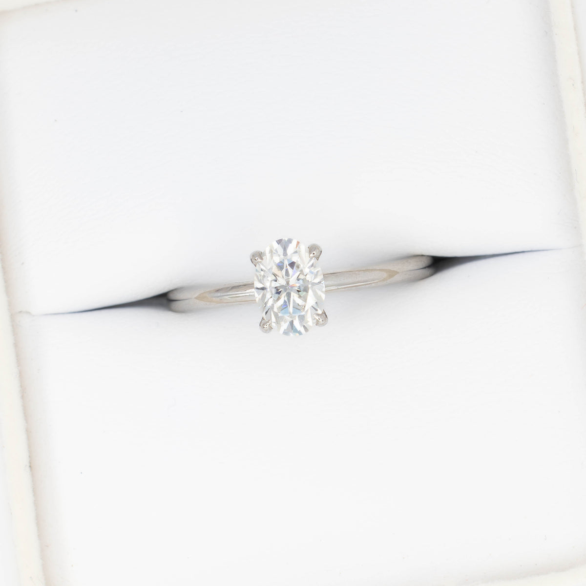 charmaine solitaire ring in white gold with oval white moissanite

