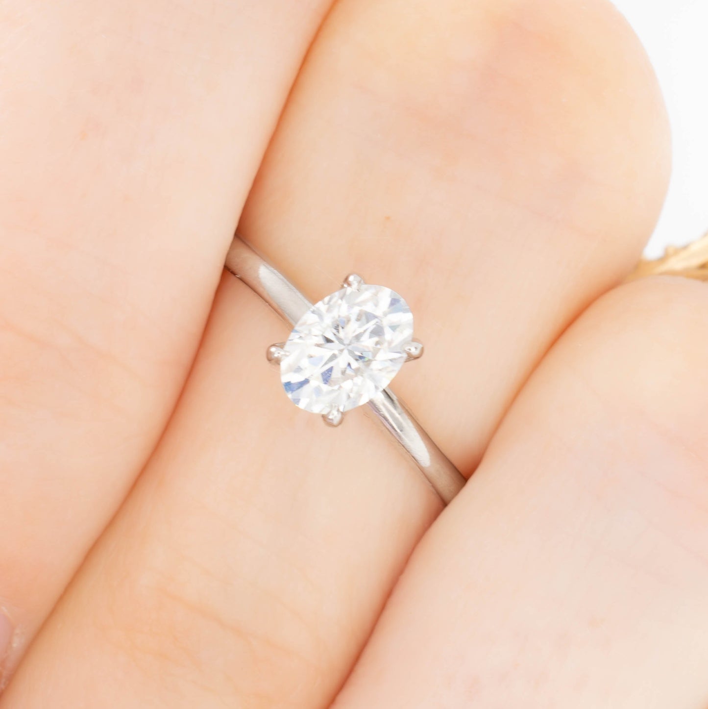 charmaine solitaire ring in white gold with oval white moissanite