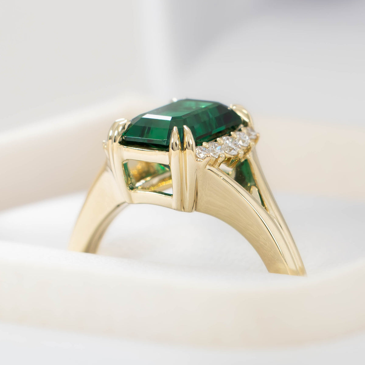 cindy accented split shank ring in yellow gold with radiant lab emerald