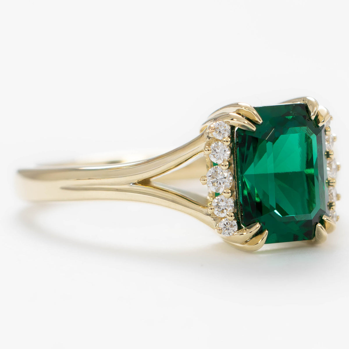 cindy accented split shank ring in yellow gold with radiant lab emerald